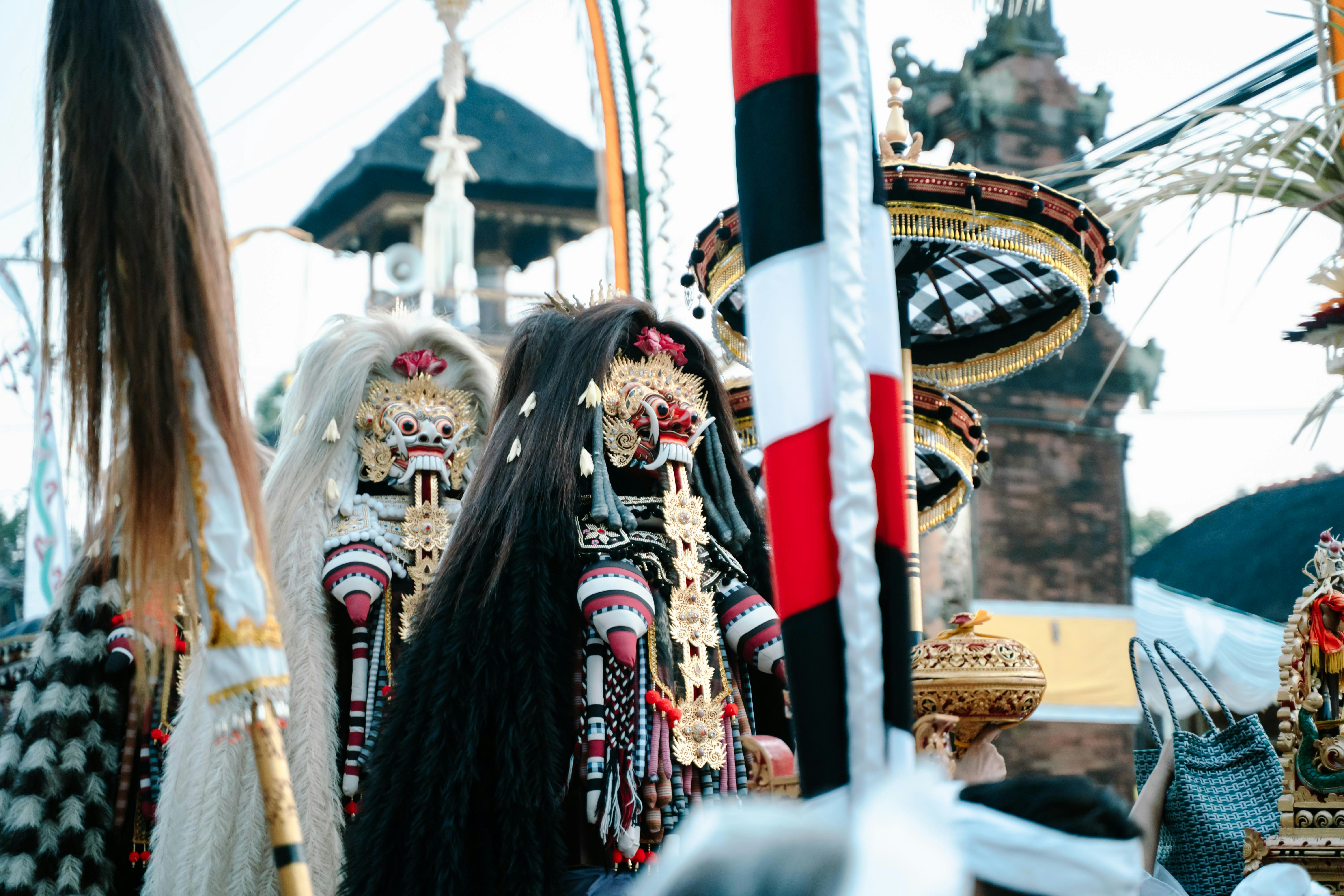 People in traditional balinese costumes with elaborate headdresses.
