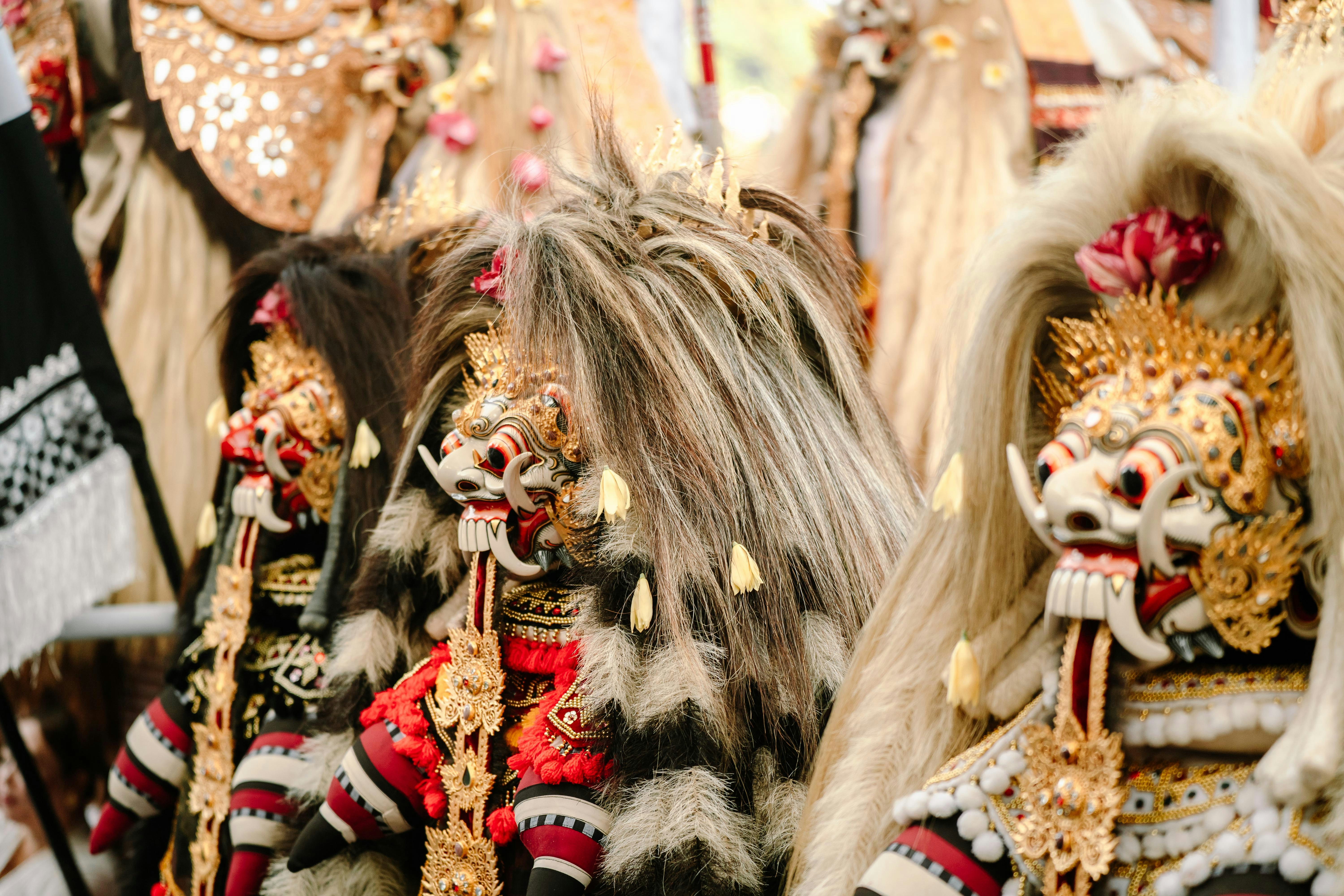 Close-up of traditional balinese barong masks with elaborate headdresses