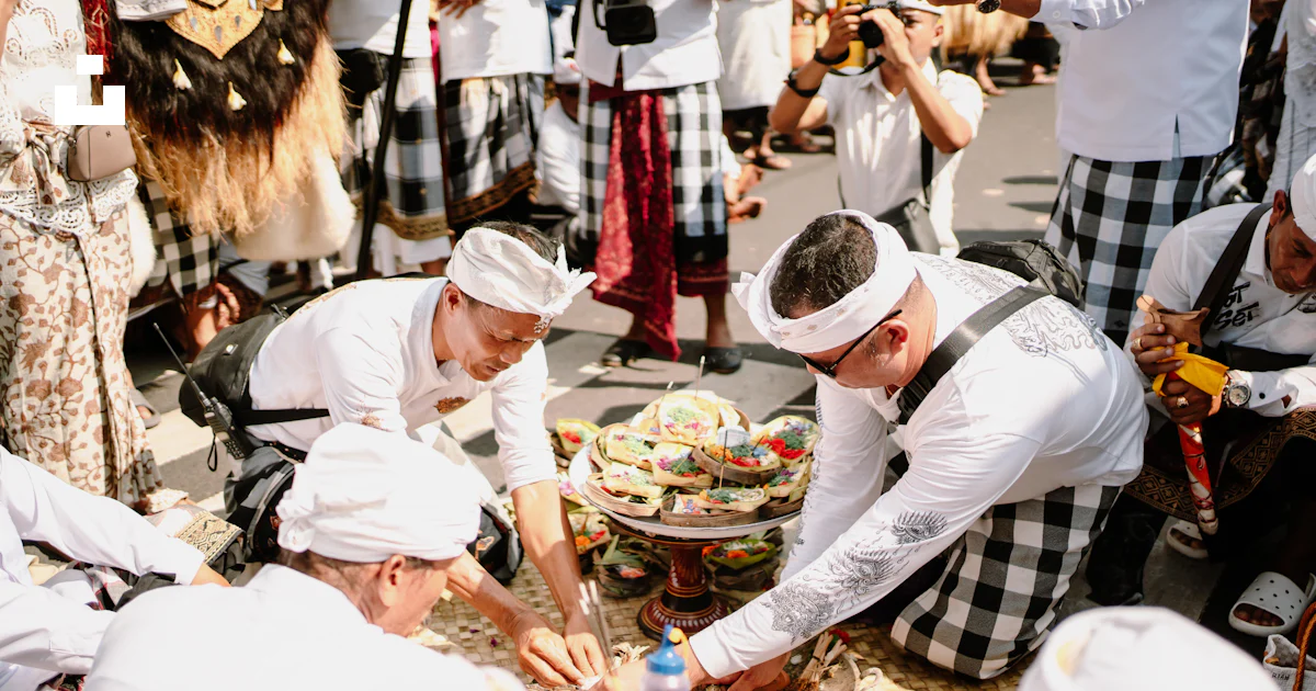 Traiditional Ritual Men in traditional attire perform a ritual outdoors. photo – Free ...