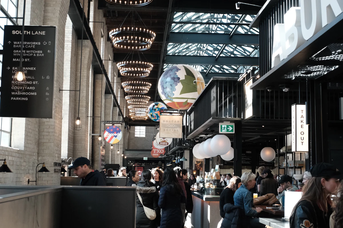 Representative image: a busy indoor market with food stalls and people