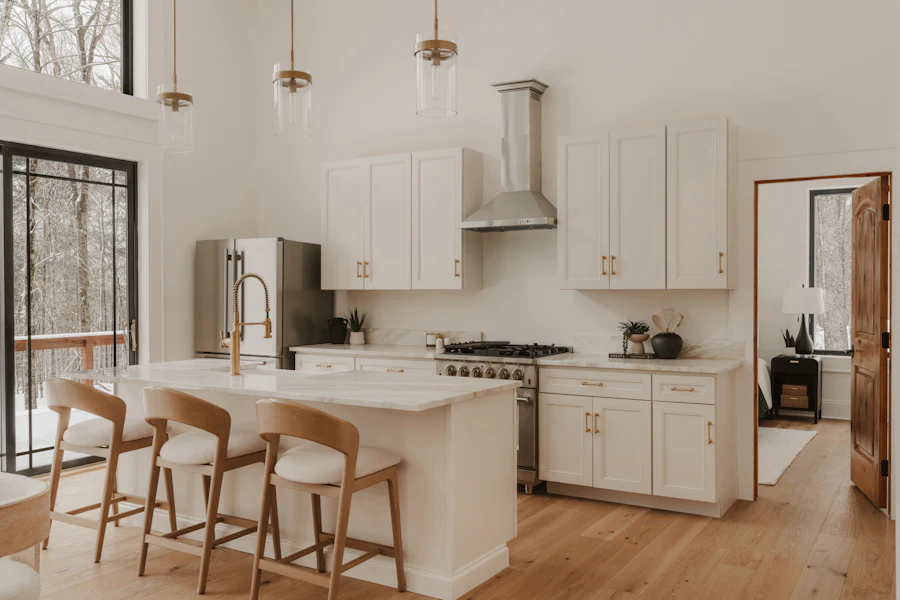 A spotless white kitchen with an island
