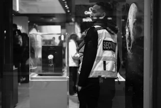 Security guard wearing a reflective vest in a store.