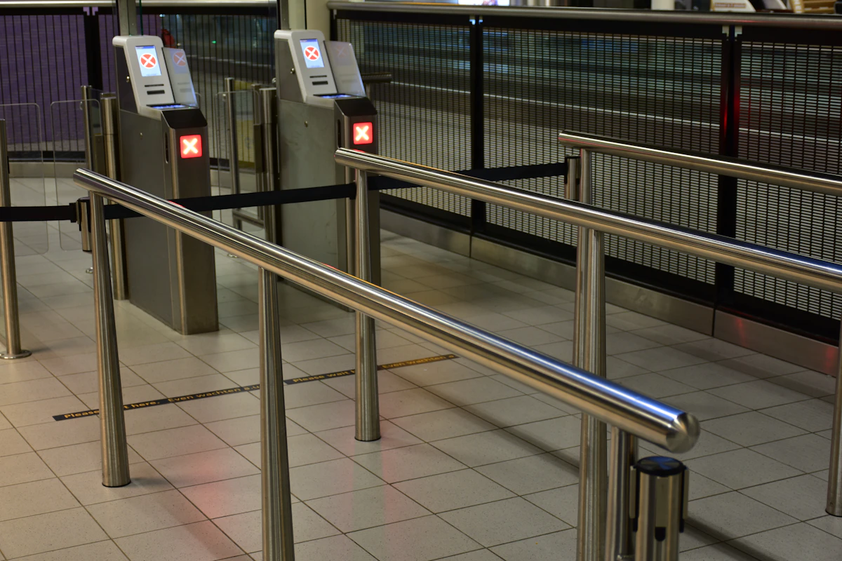 Travellers queuing at an airport security checkpoint
