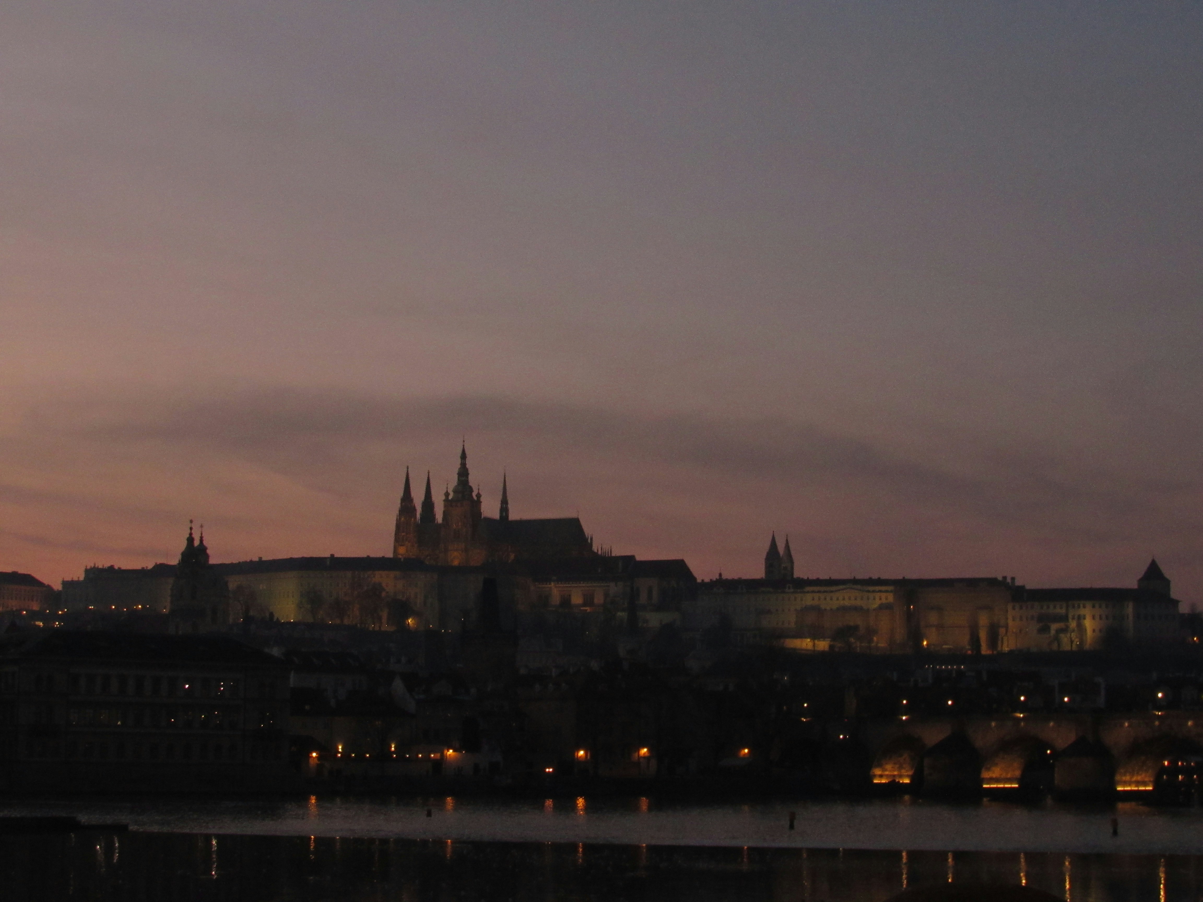 City skyline with castle at dusk