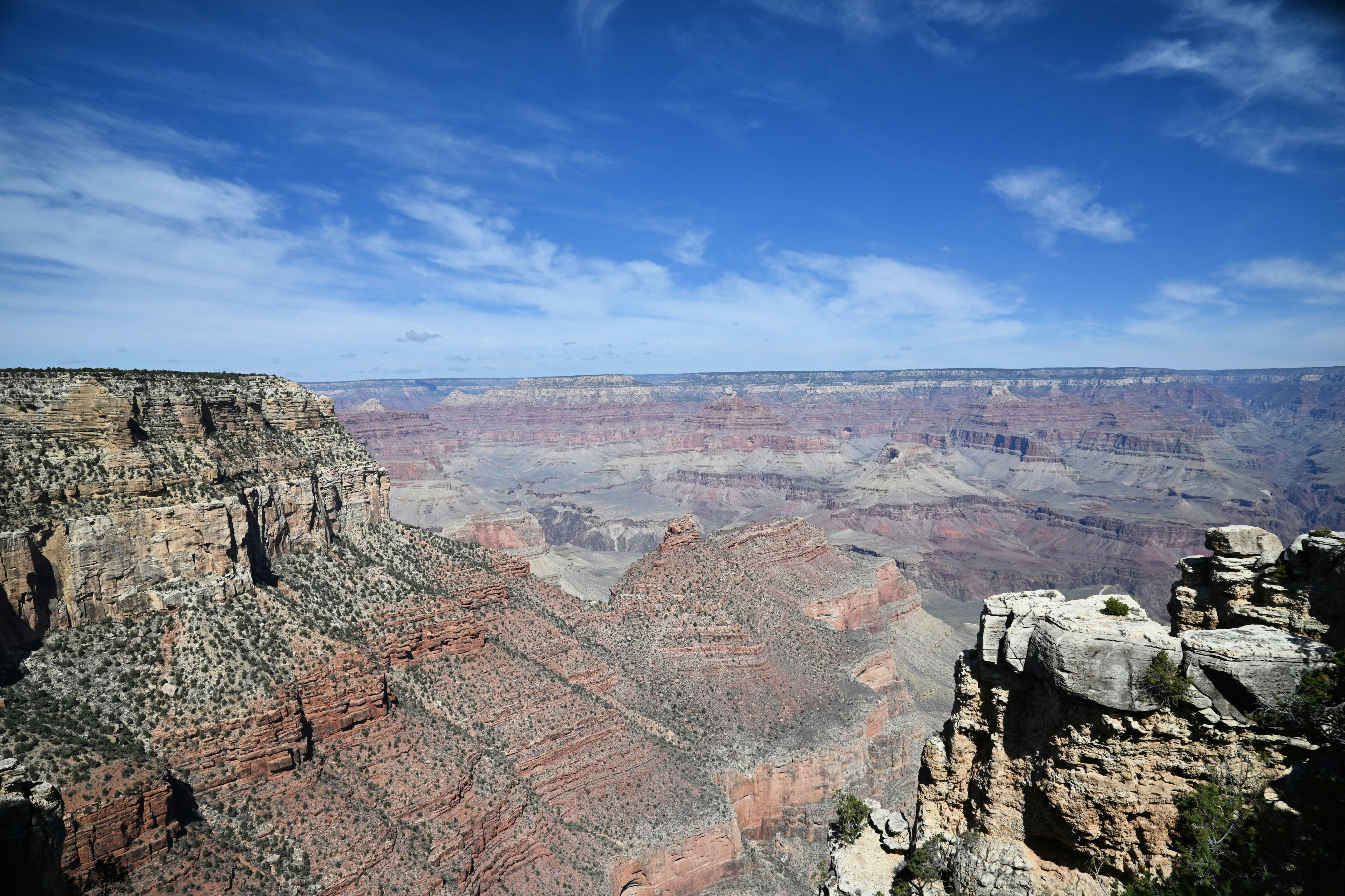 Vast canyon landscape under a blue sky