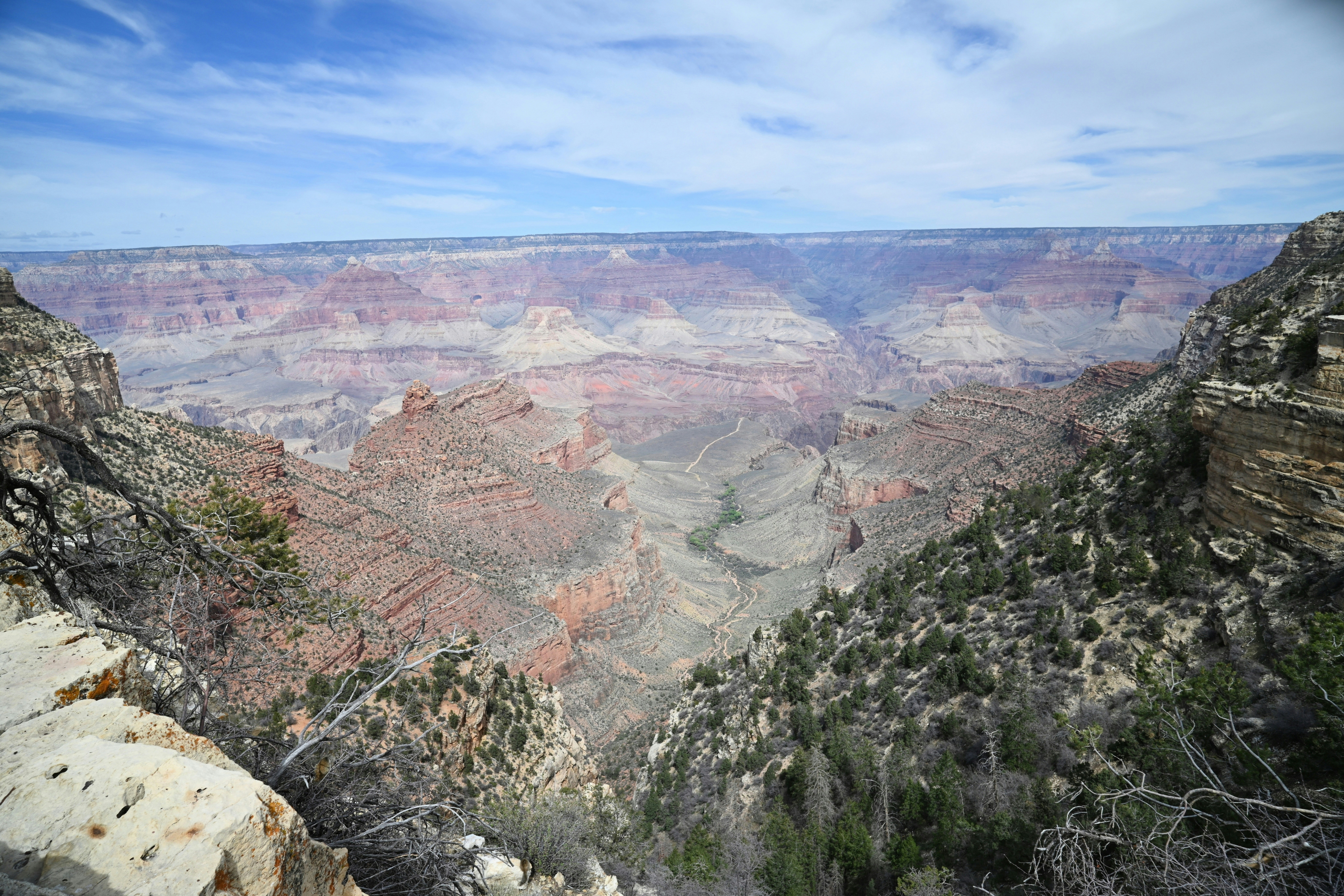 Expansive view of the grand canyon under a cloudy sky