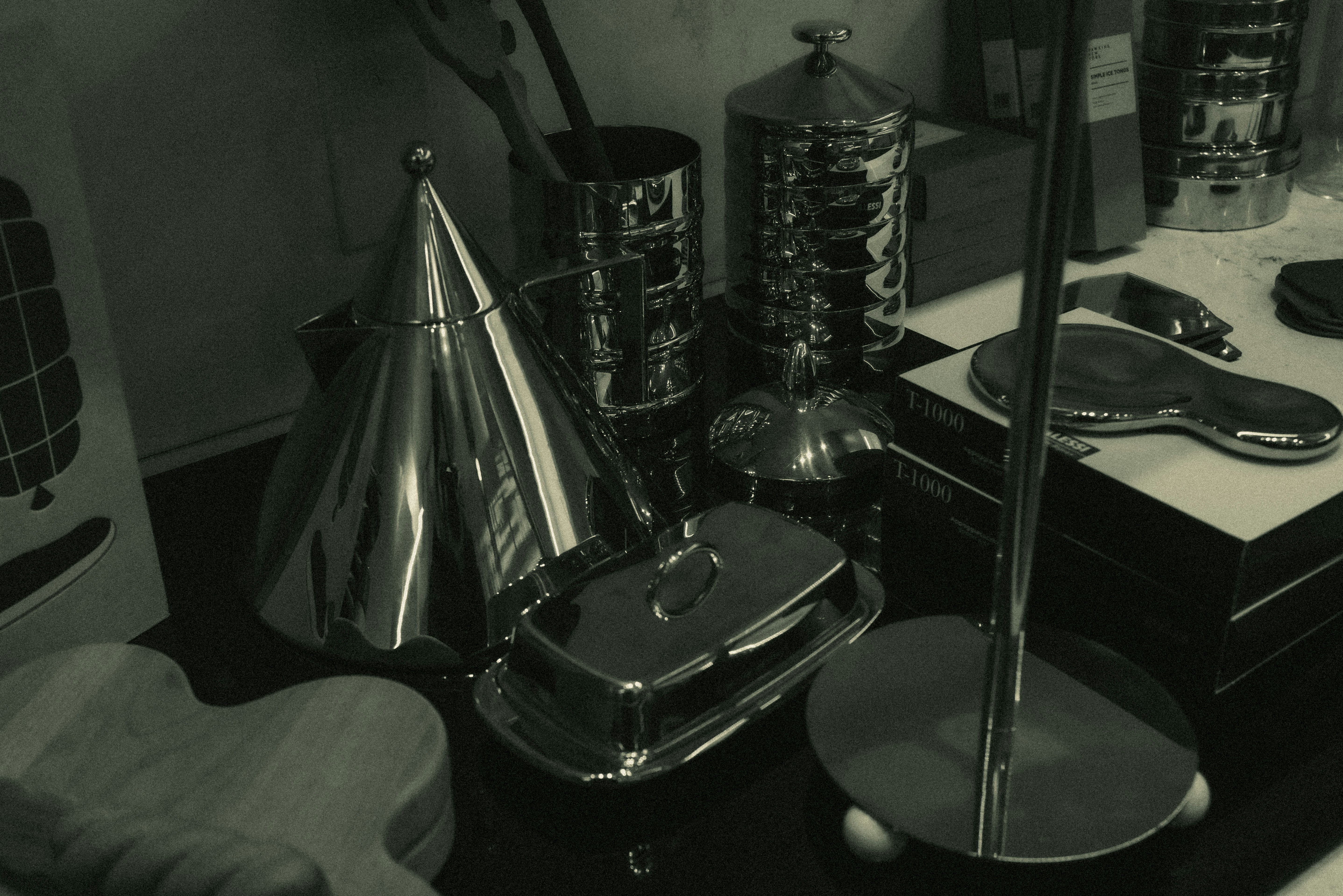 Collection of shiny metallic kitchenware and objects