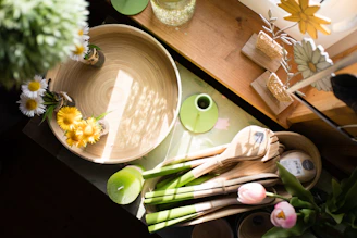 Wooden platter with spring flowers and vegetables