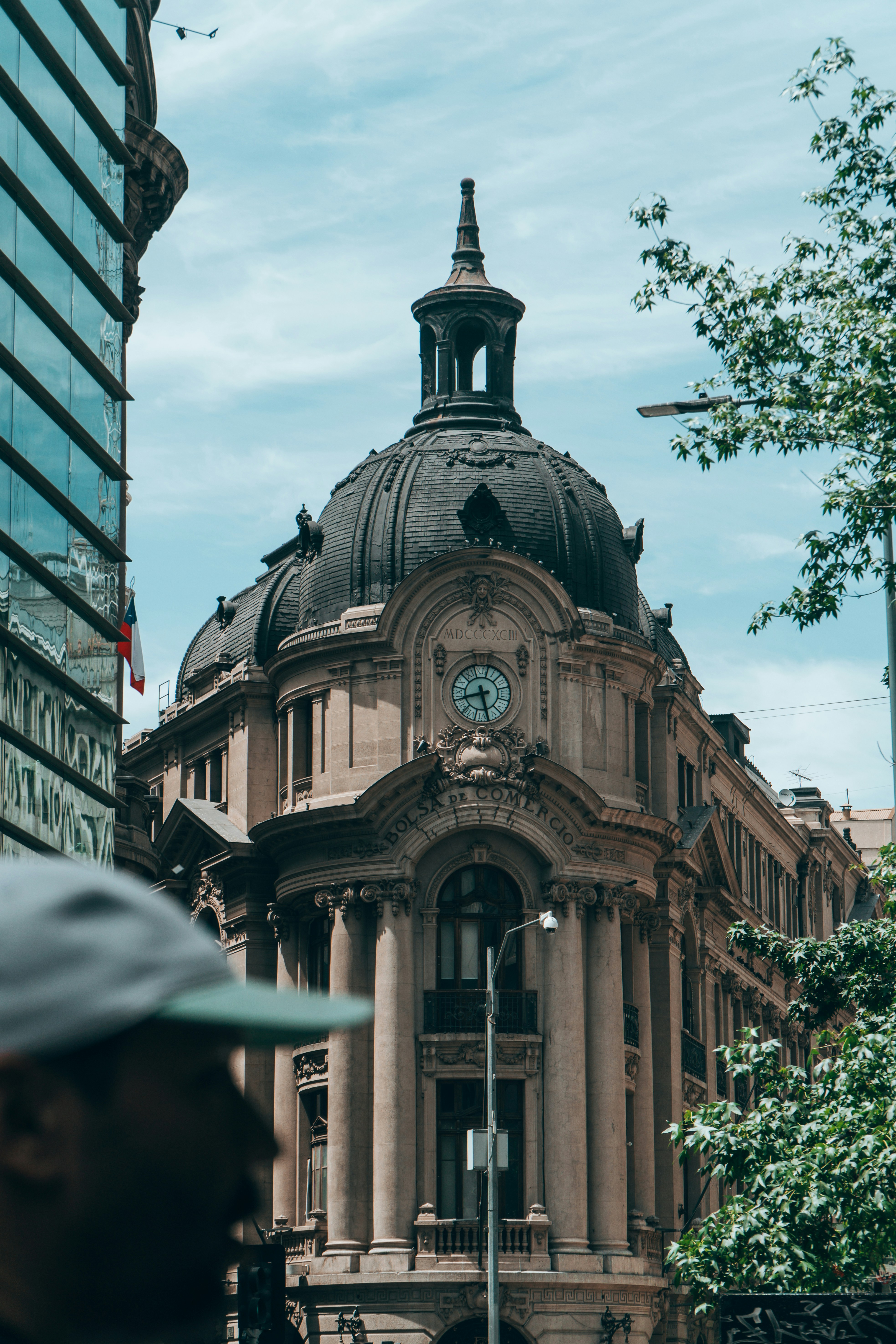 Ornate building with a dome and clock tower.