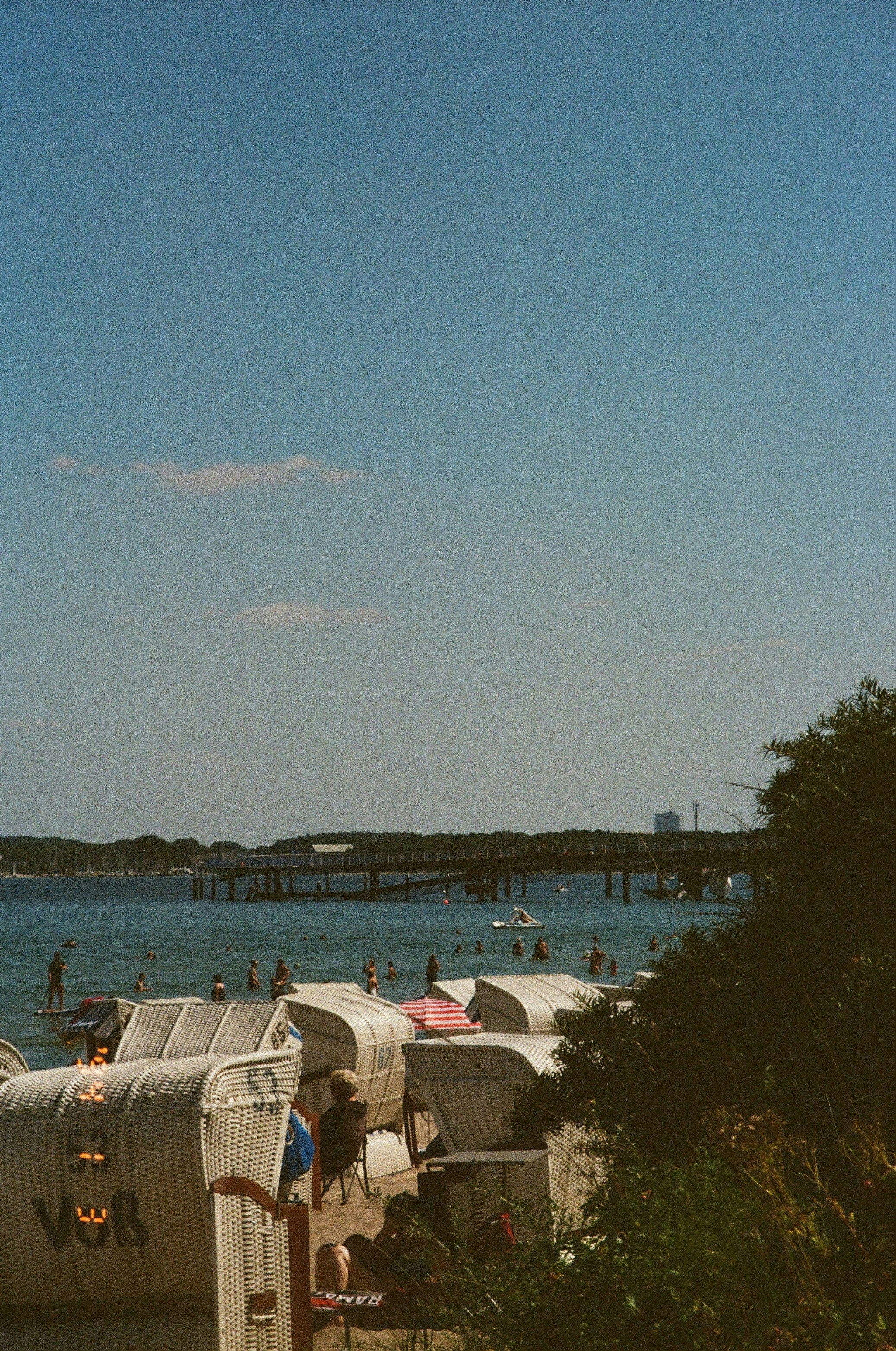 Beach chairs on a sunny day by the ocean.