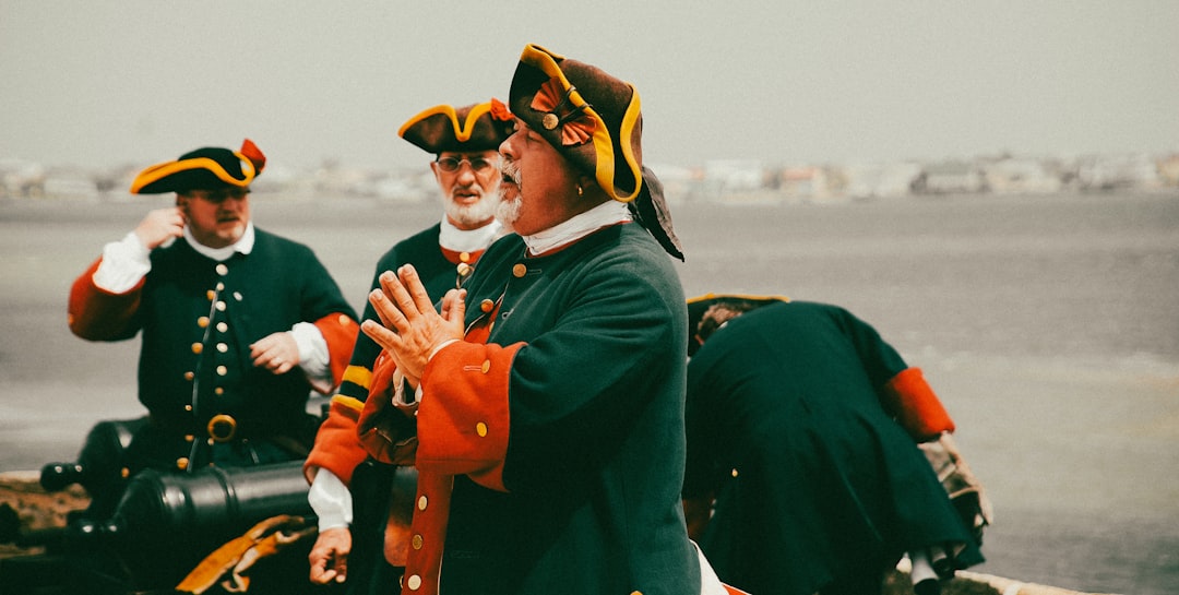 Men in historical uniforms with a cannon