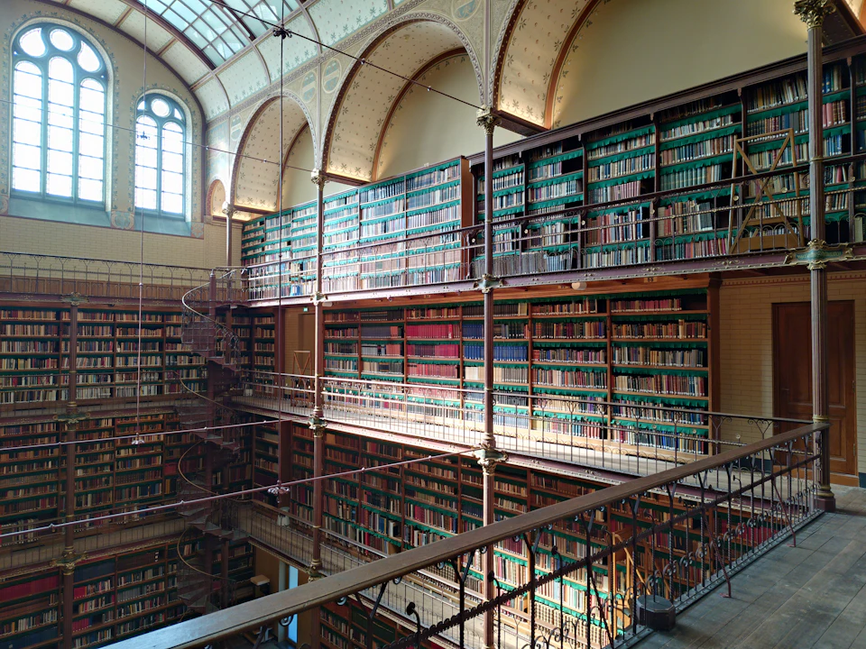A multi-level library with rows of bookshelves