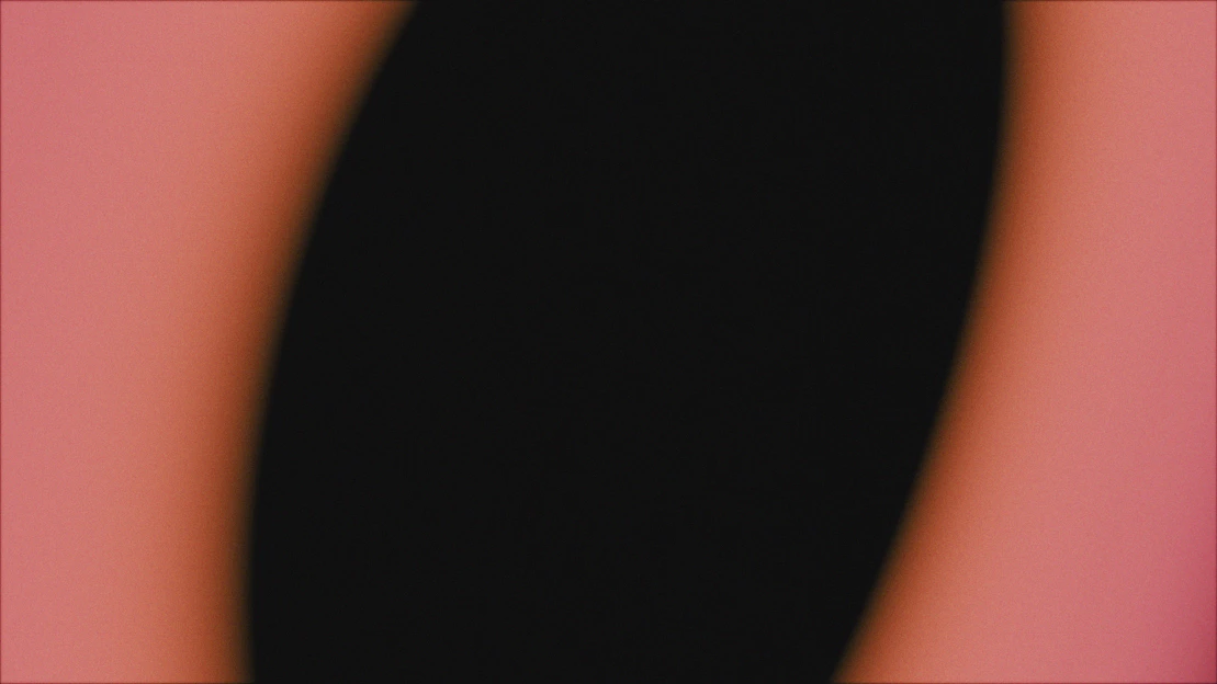 Abstract black shape on a soft pink background