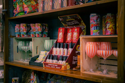 FMCG beverage POS - branded spirits merchandise including whisky glasses, mugs, tote bags, t-shirts and gift sets for Diageo, Pernod Ricard and premium spirits brands