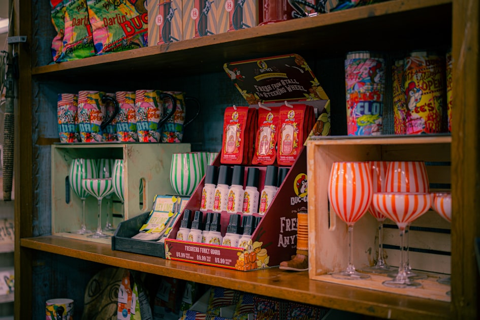 Shelves display colorful items and glassware