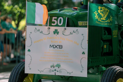 Green tractor with irish flag and shamrocks