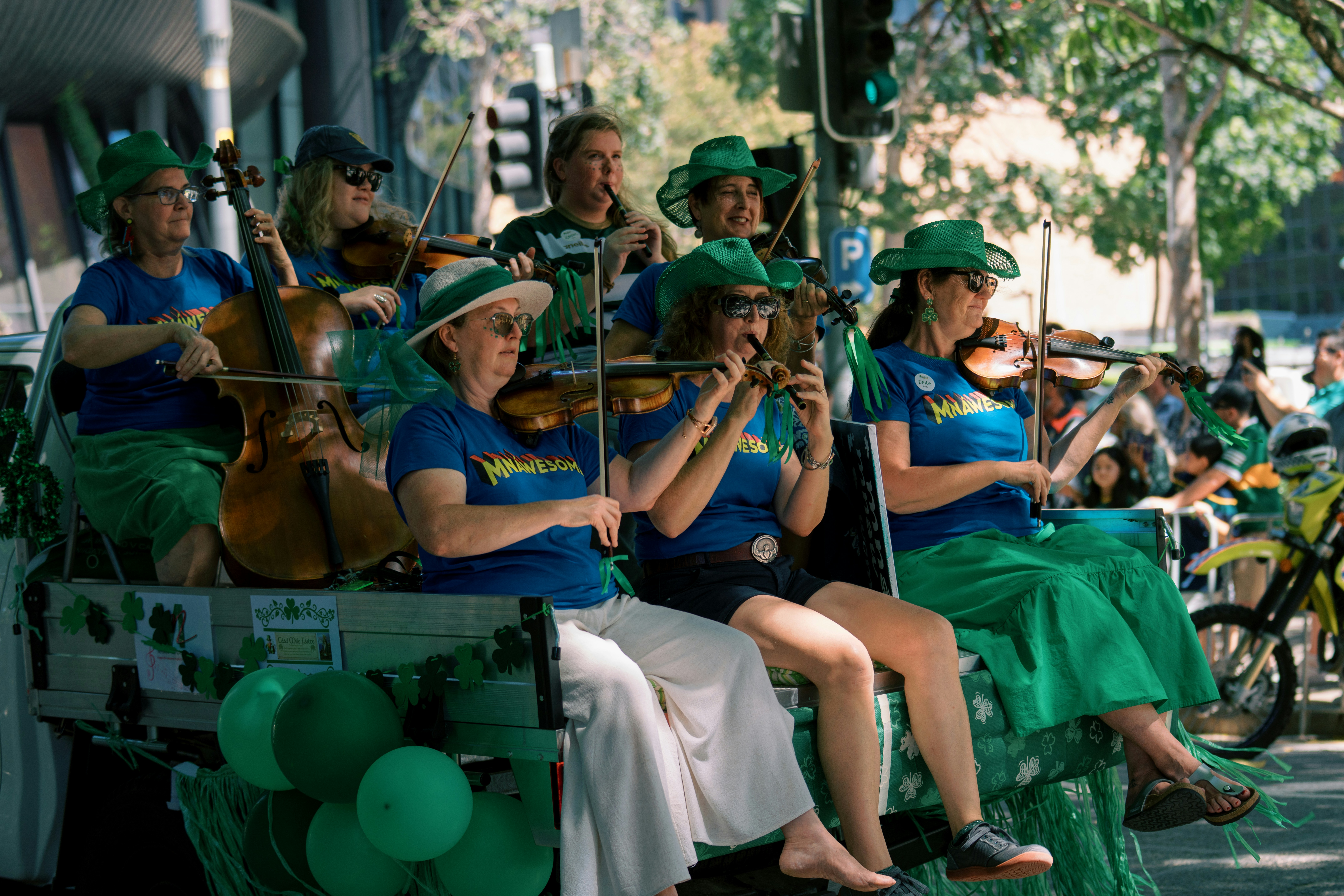 A group of women playing instruments on a float.