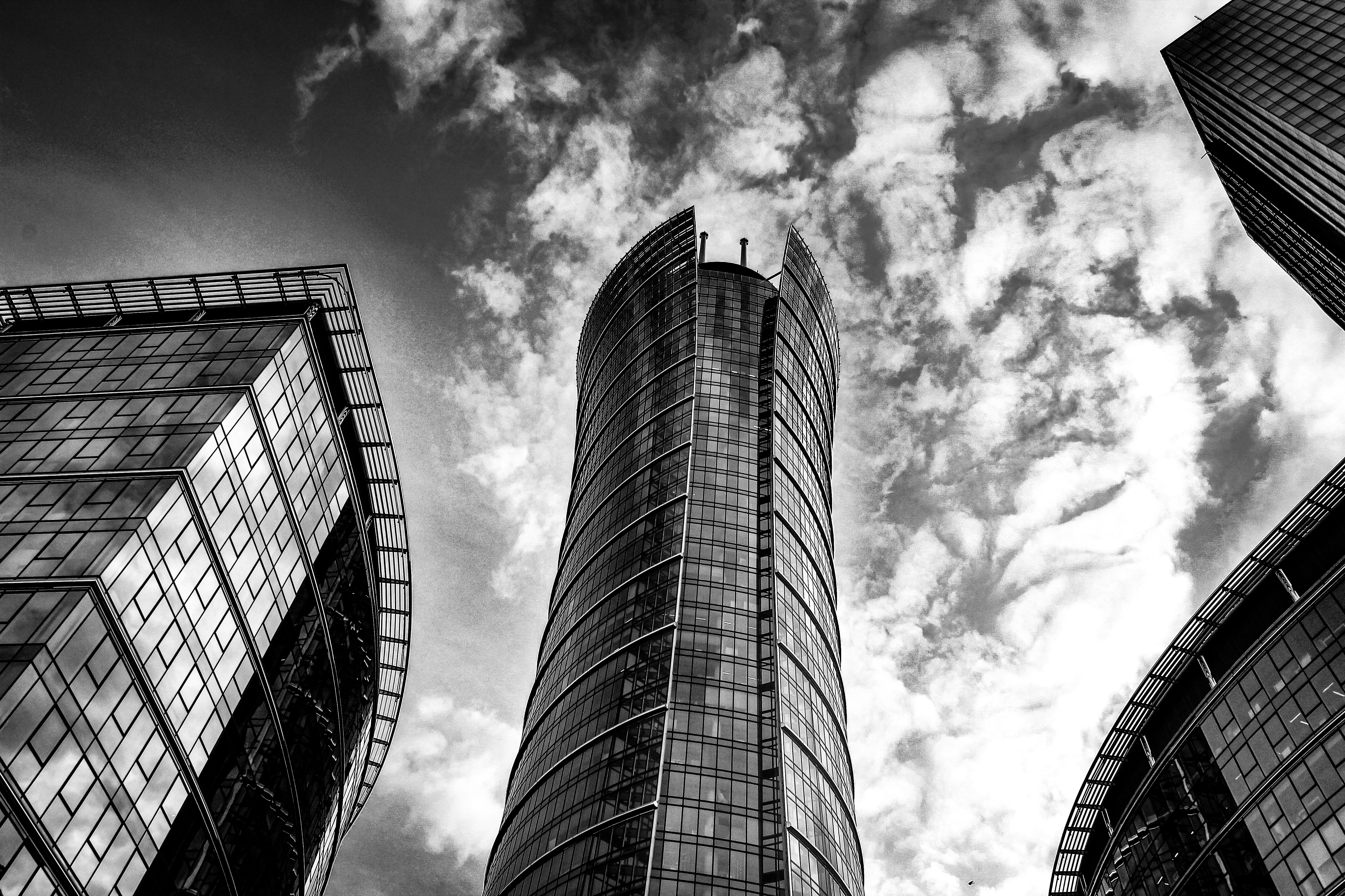 Modern skyscrapers against a dramatic cloudy sky