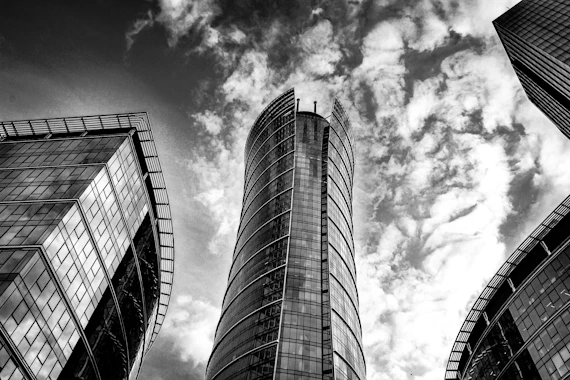 Modern skyscrapers against a dramatic cloudy sky