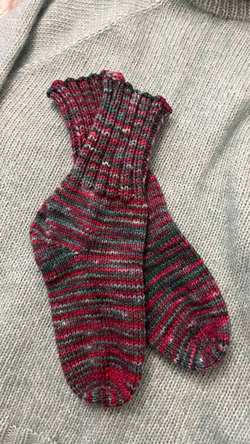 colourful striped hand-knitted socks in pink and grey