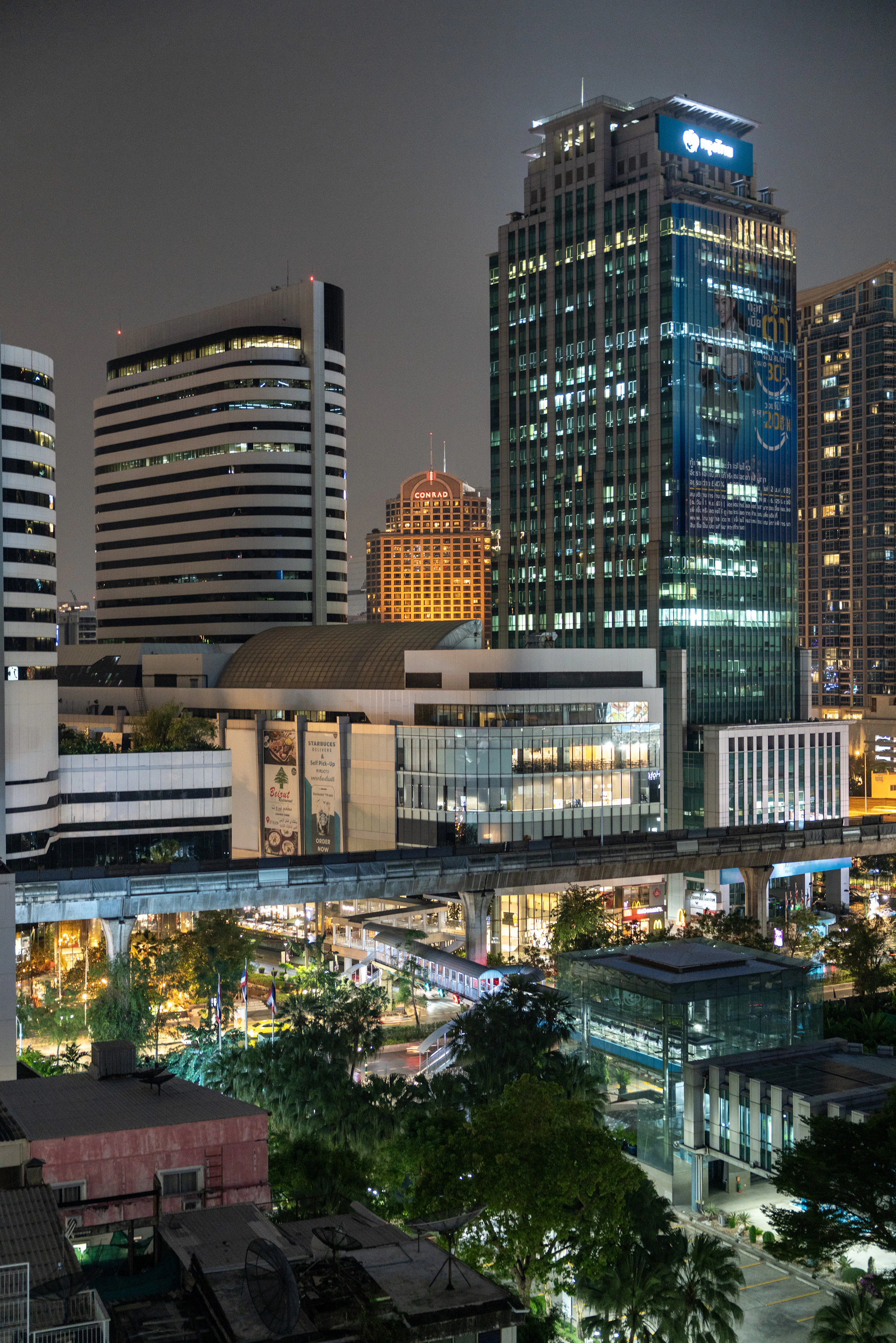 Modern Bangkok skyline illuminated at night, Thailand