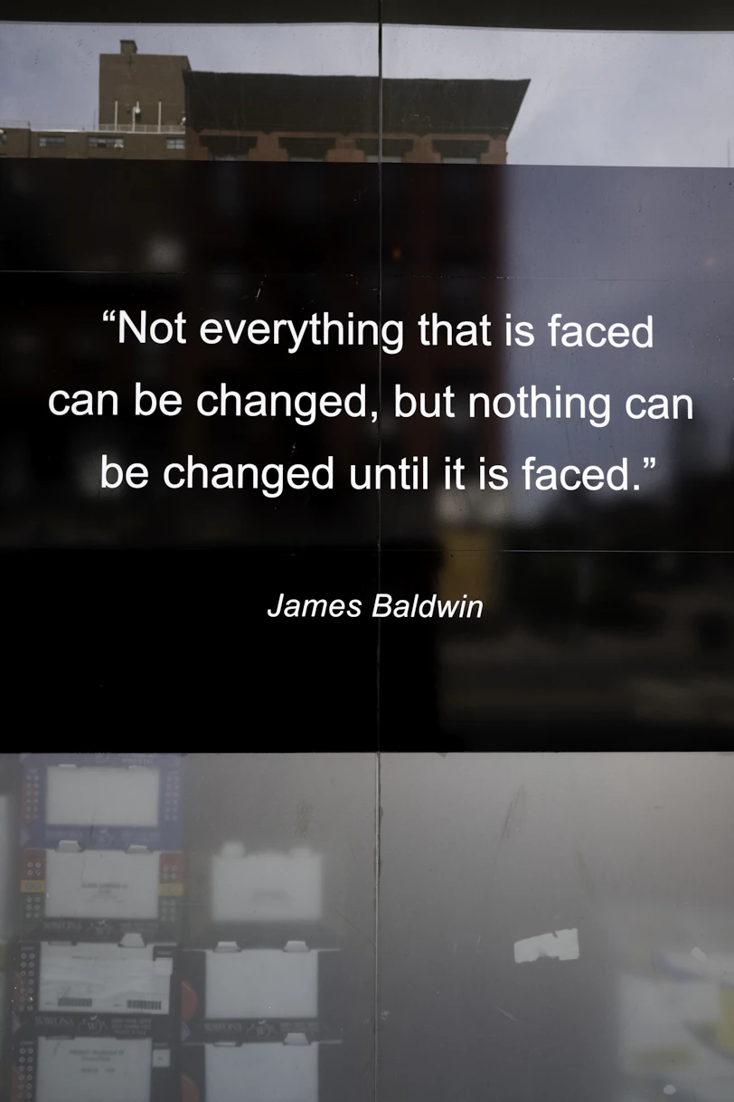 James baldwin quote on a building reflection