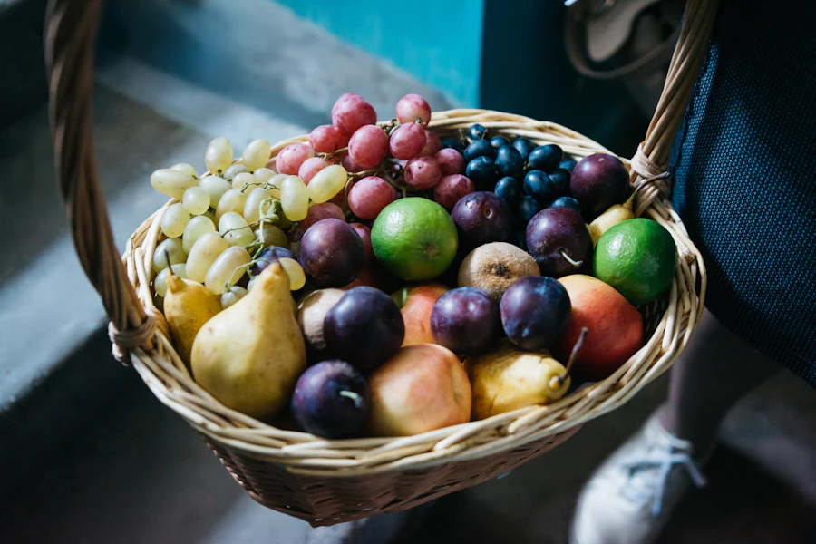 Woven wicker basket filled with fresh seasonal fruit