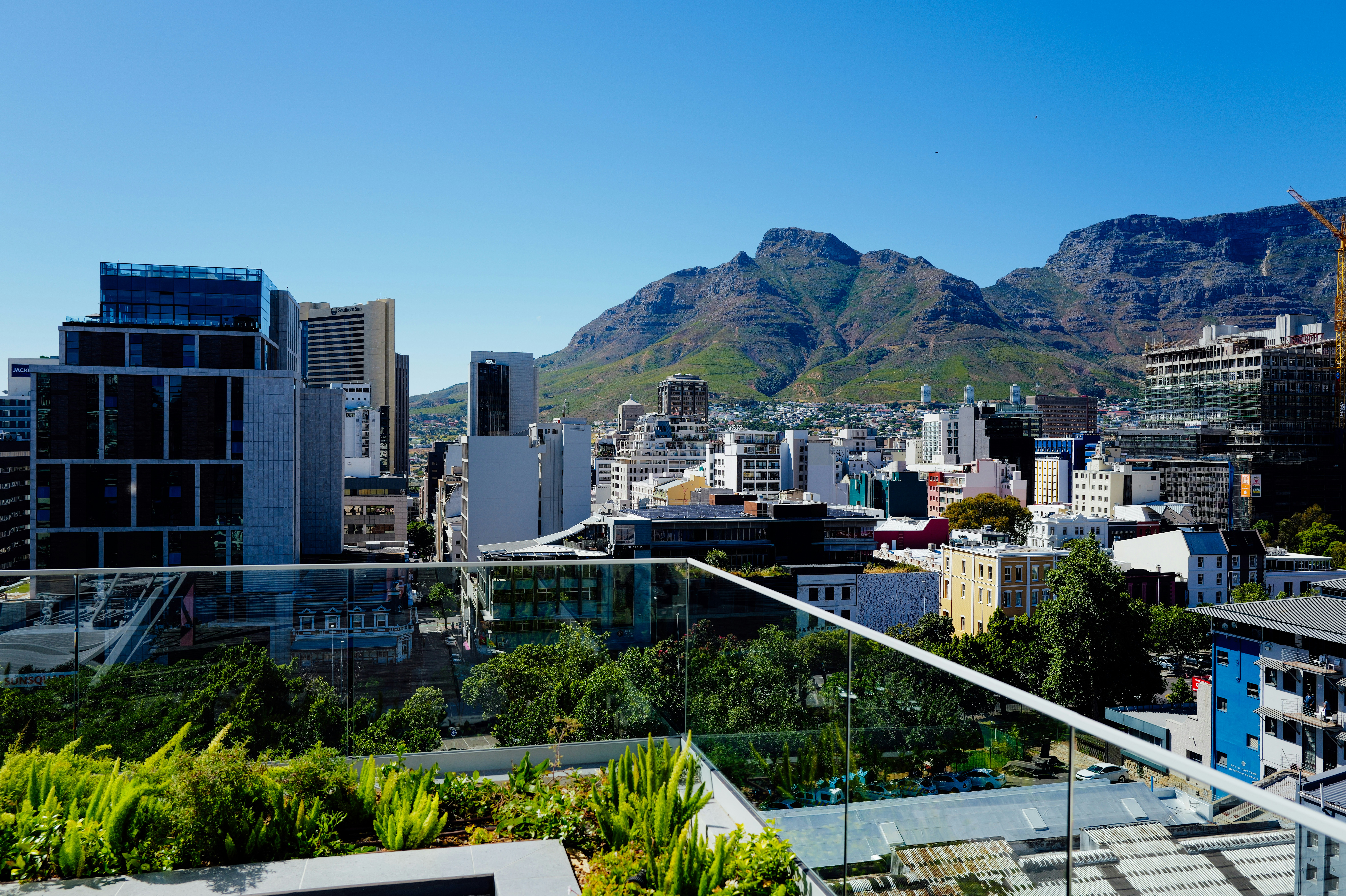 City skyline with mountains in the background