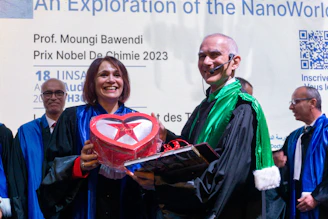 Woman receives a heart-shaped box from a man