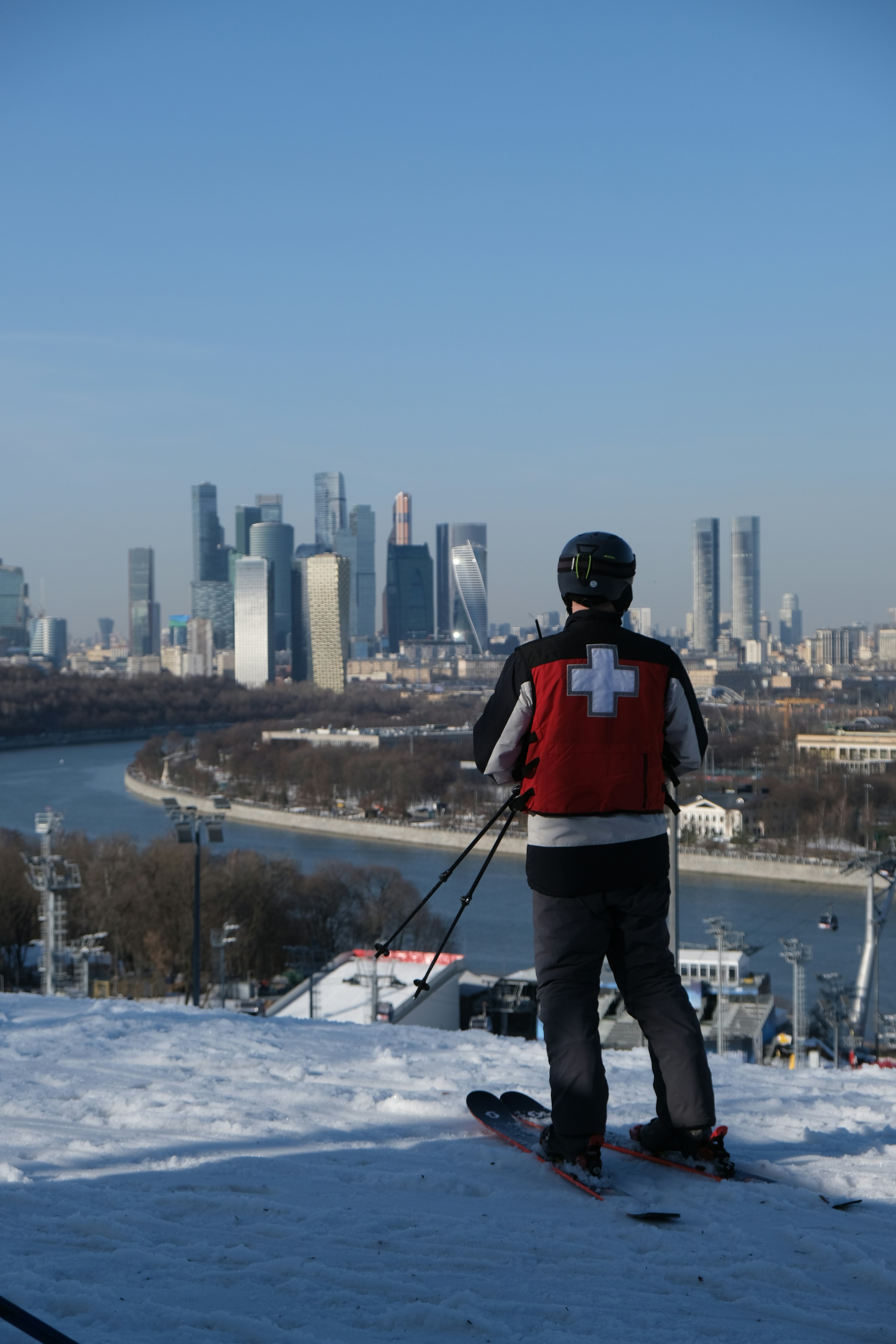 Skier with city skyline in background