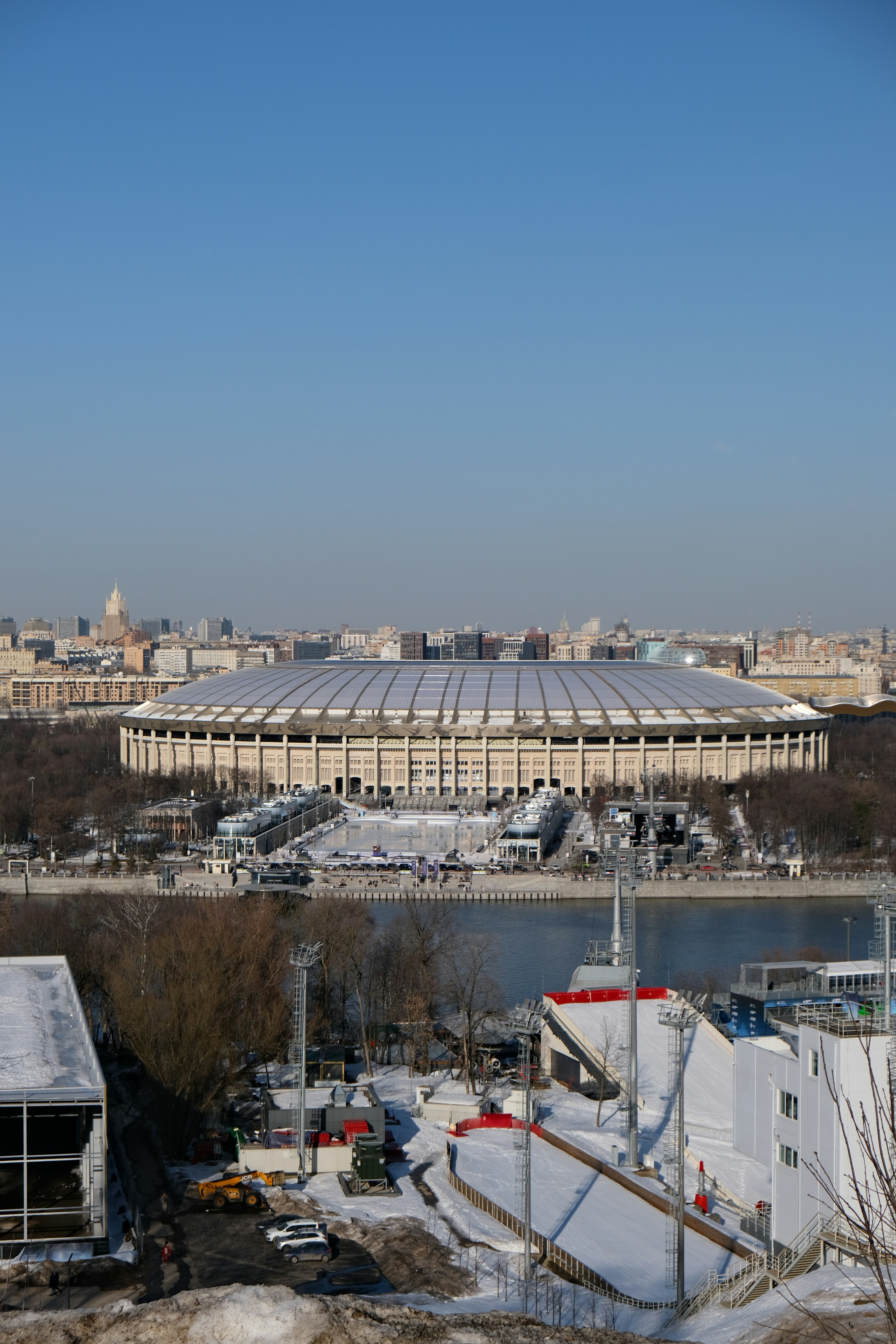Large stadium with a domed roof and cityscape background.