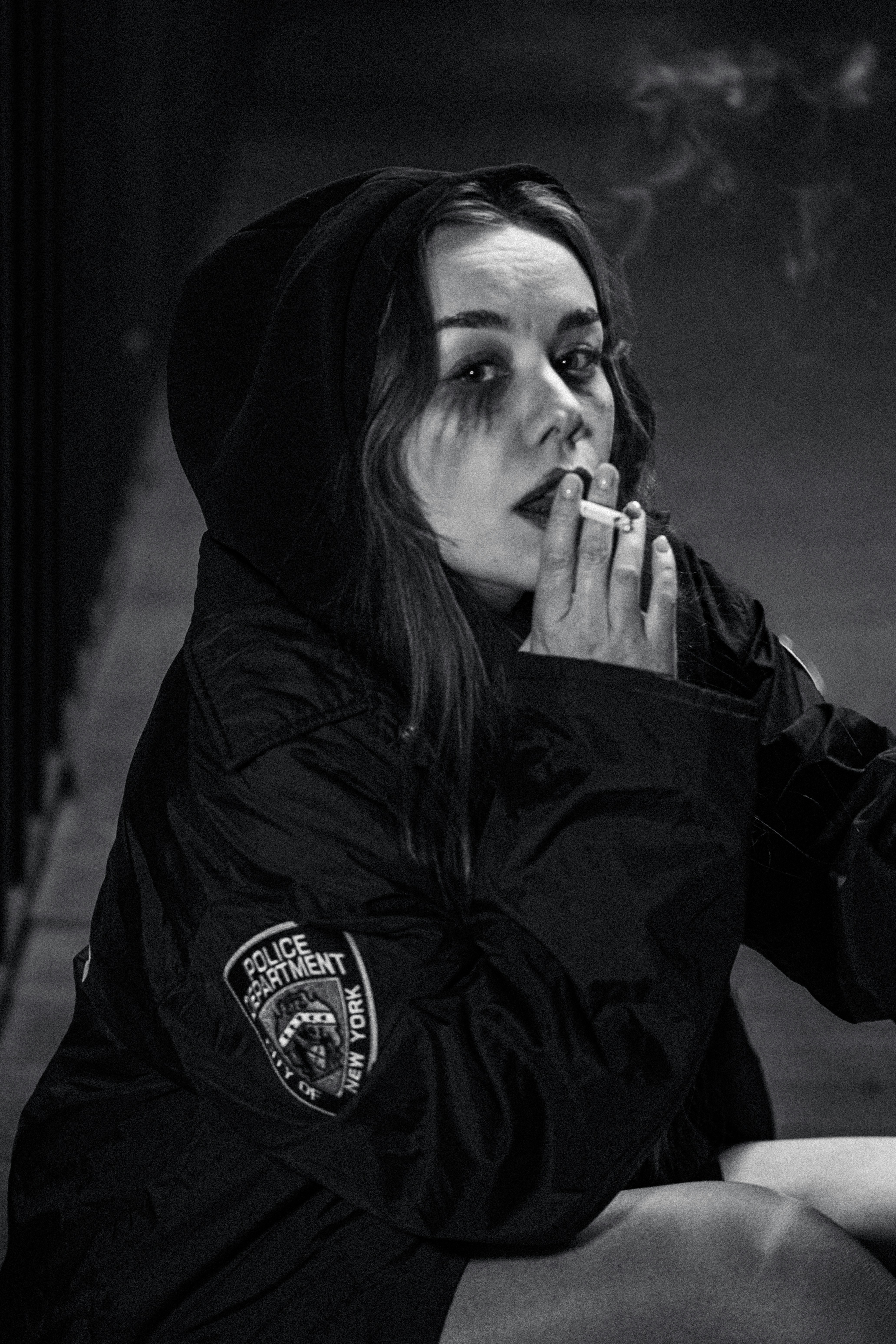 Woman in uniform smoking a cigarette
