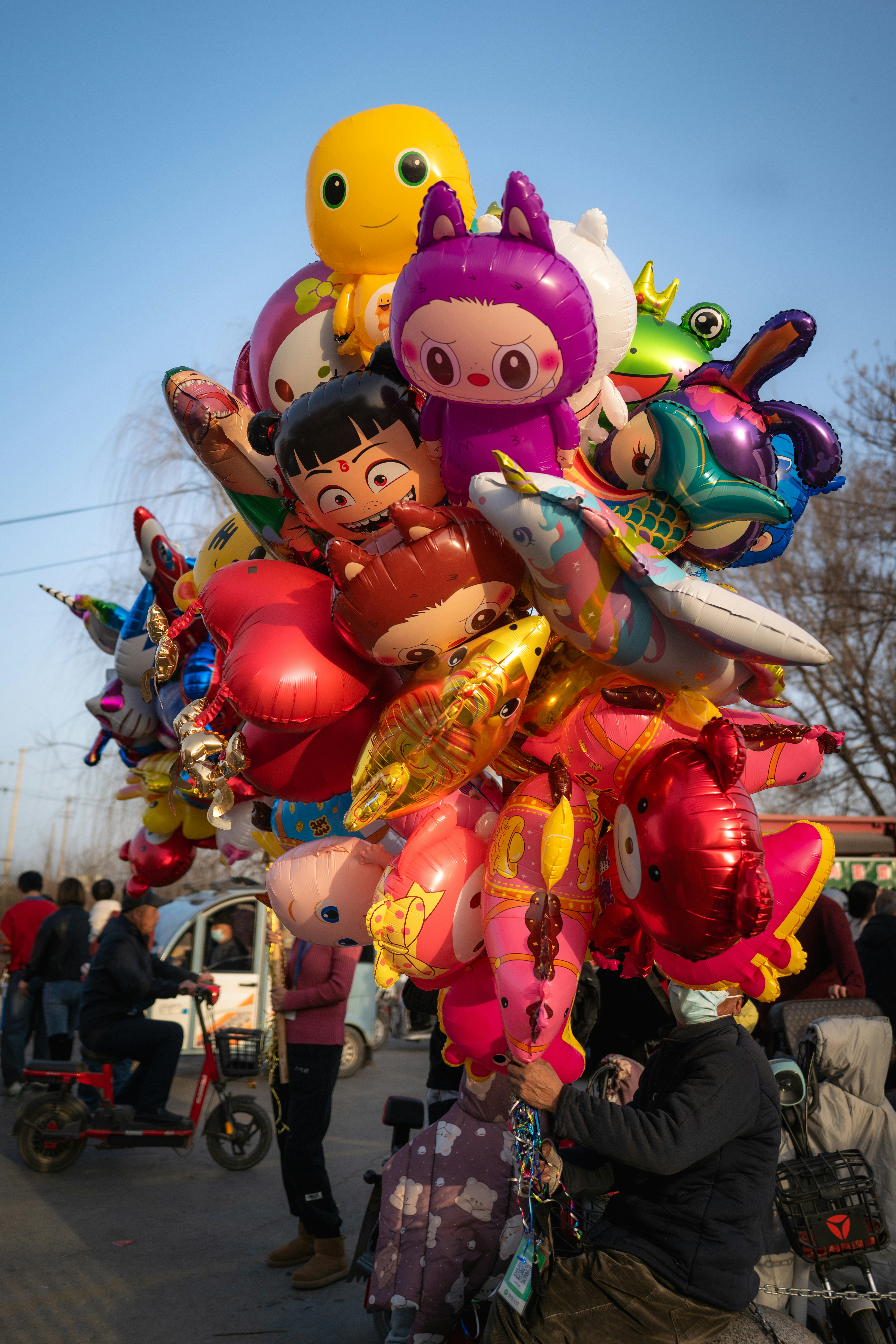 A colorful bouquet of cartoon character balloons