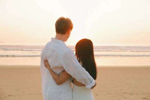 Couple embracing on a beach at sunset