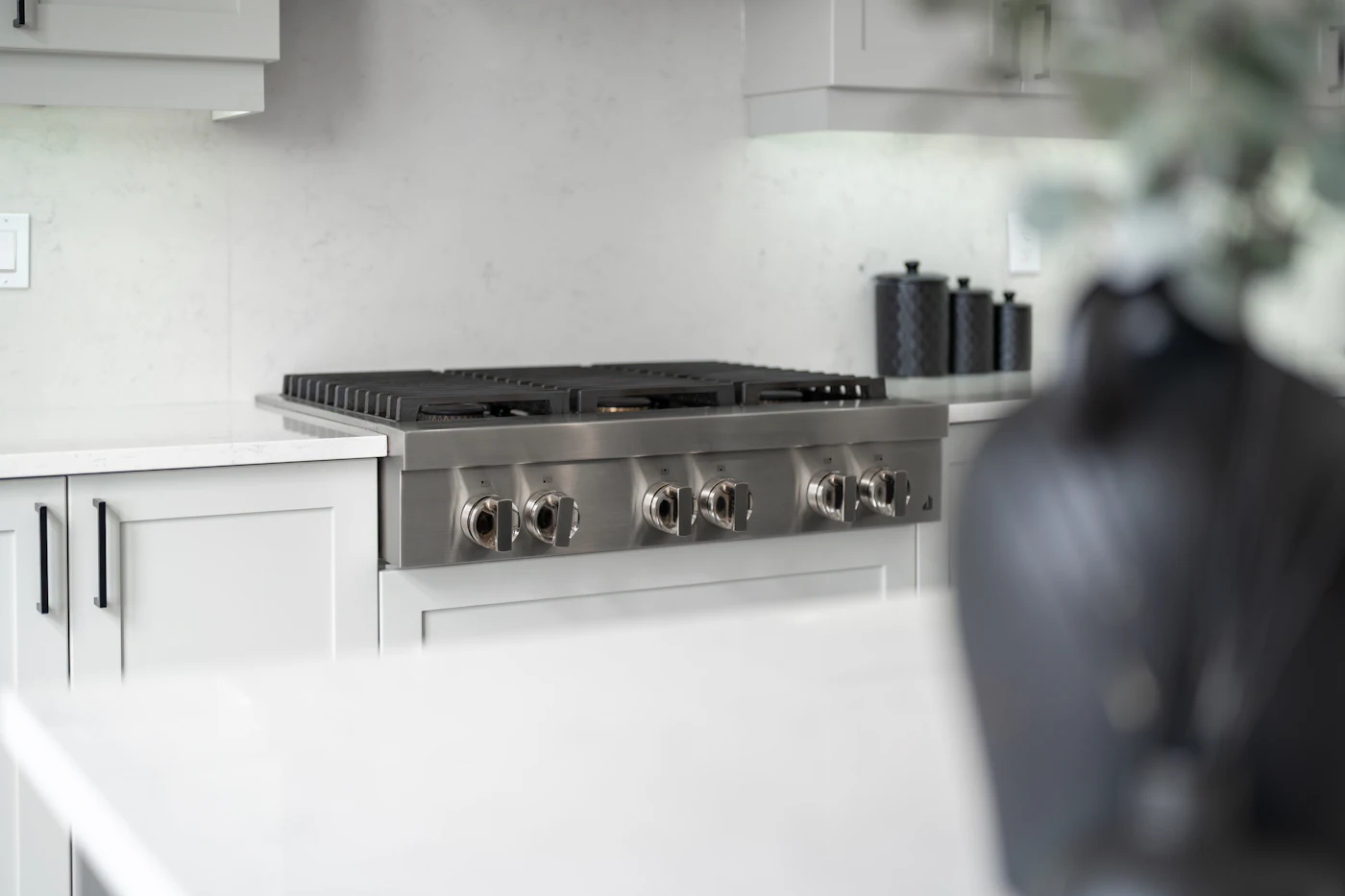 Modern stainless-steel gas range in a fitted kitchen
