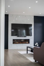Modern living room with fireplace and large television