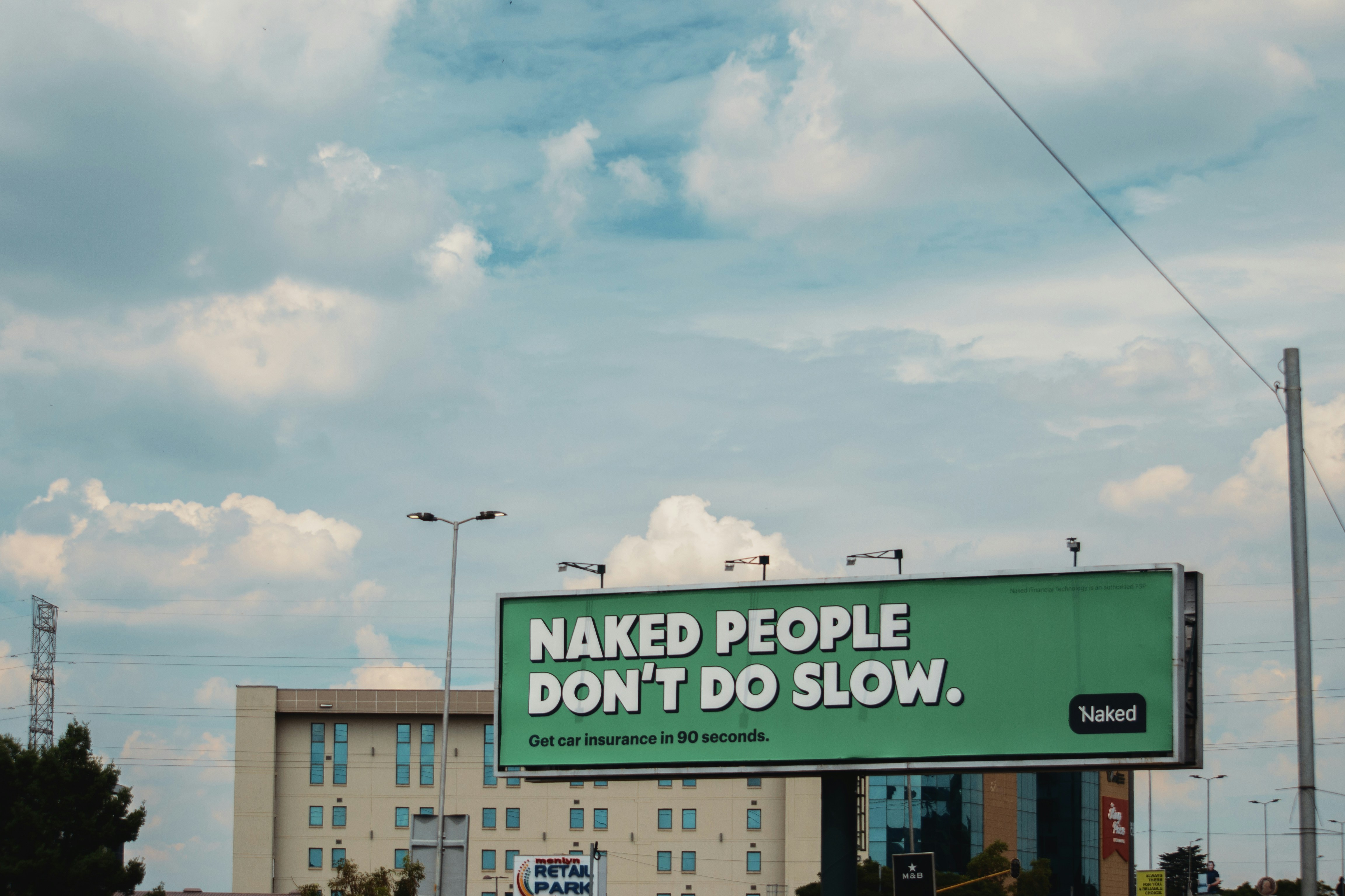 Billboard with text "naked people don't do slow."