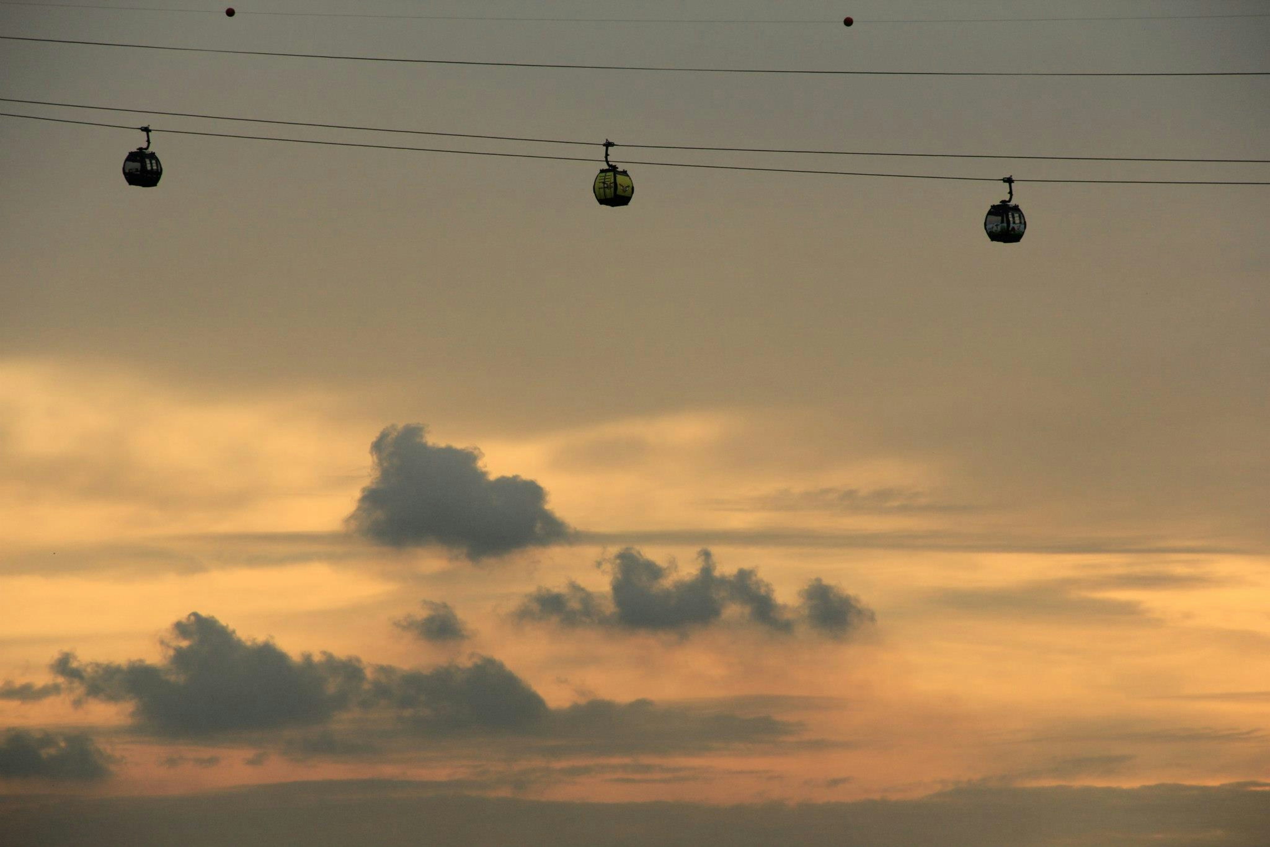Cable car gondola above Singapore harbour heading to Sentosa Island — Sentosa cable car tour
