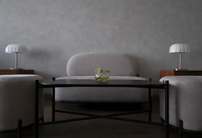 Modern living room with sofa, coffee table, and lamps