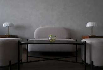 Modern living room with sofa, coffee table, and lamps