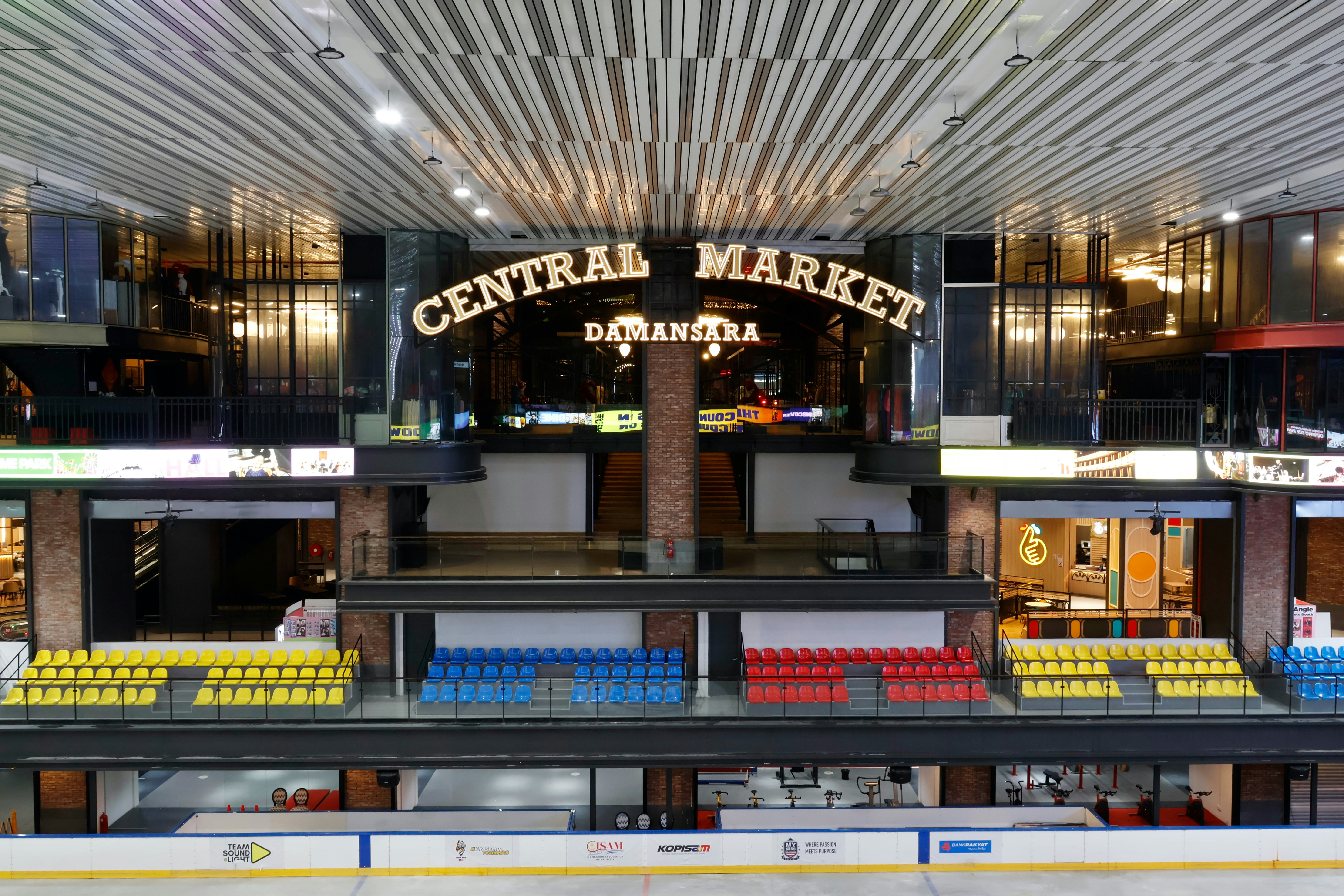 Central market building interior with shops and seating.