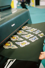 Printer producing colorful stained glass butterfly stickers.