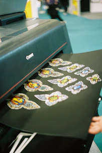 Printer producing colorful stained glass butterfly stickers.