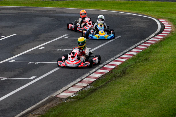 Three go-karts racing on a track