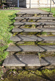 Concrete stairs with grass and shadows