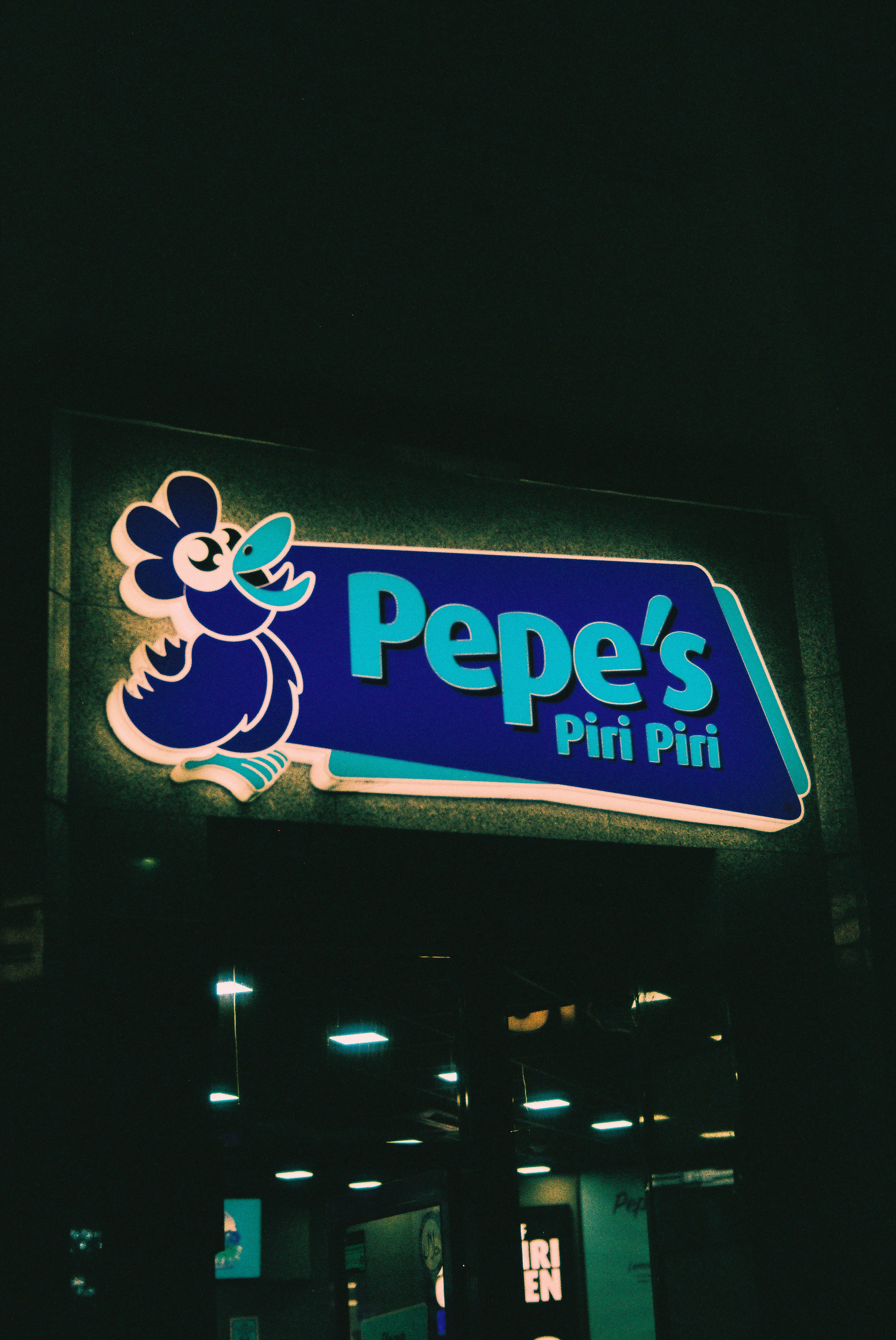 Pepe's piri piri neon sign at night