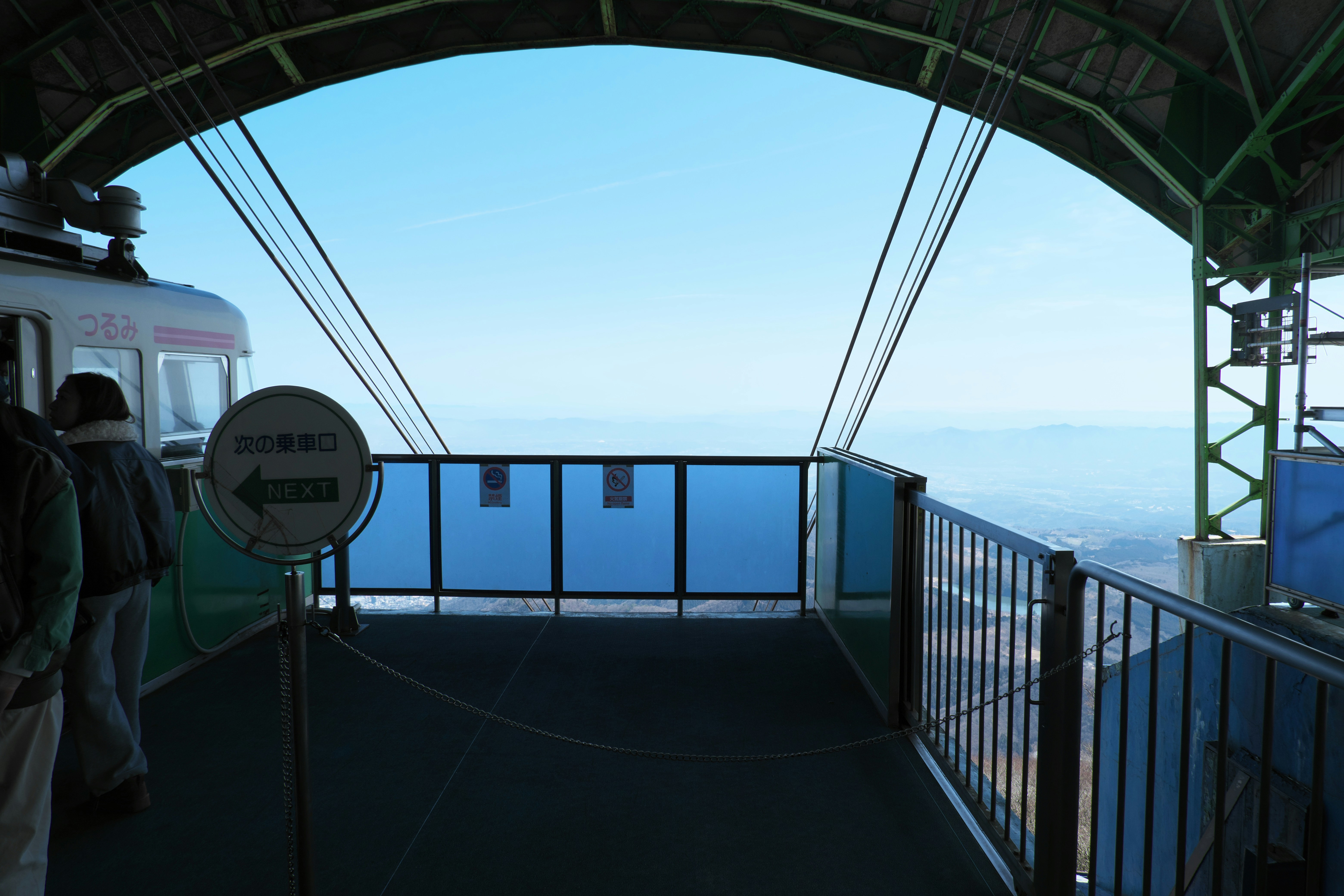 Cable car station with clear blue sky and distant horizon