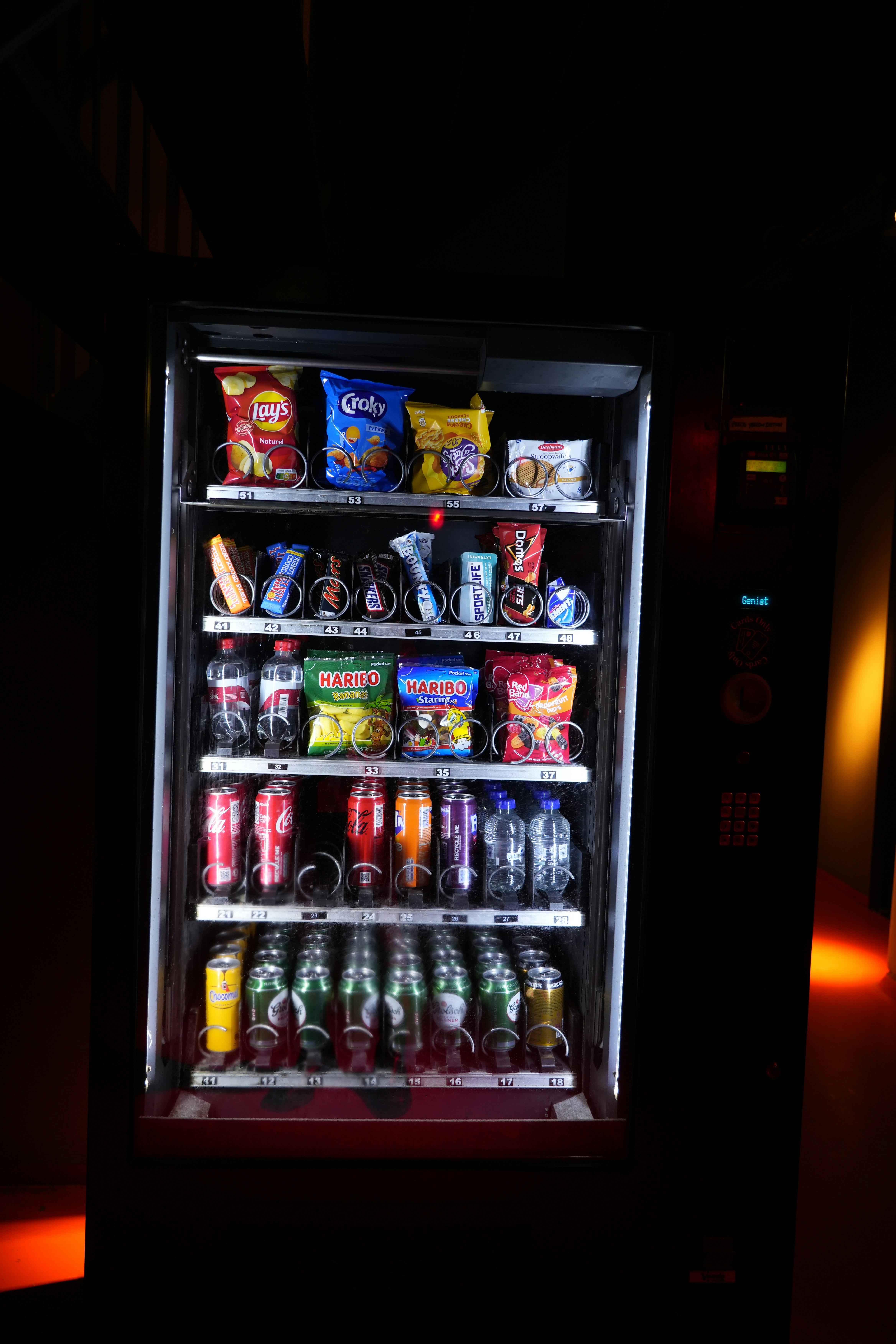 A vending machine with snacks and drinks