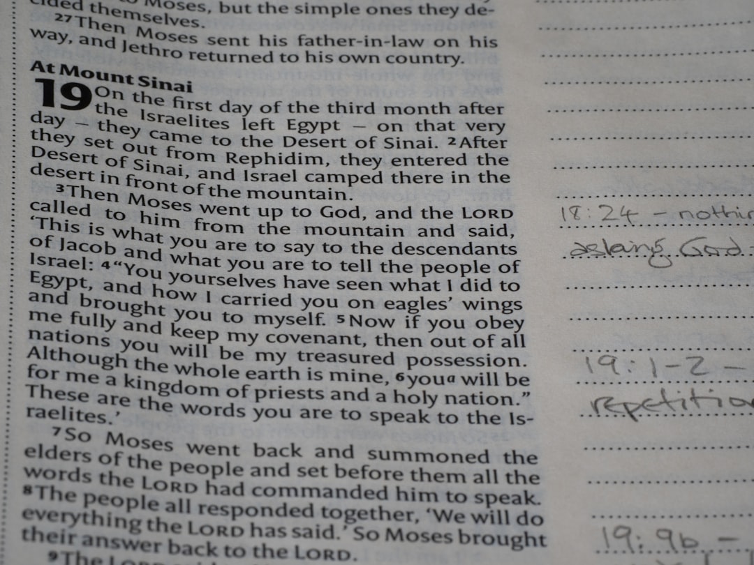Close-up of an open bible with handwritten notes.