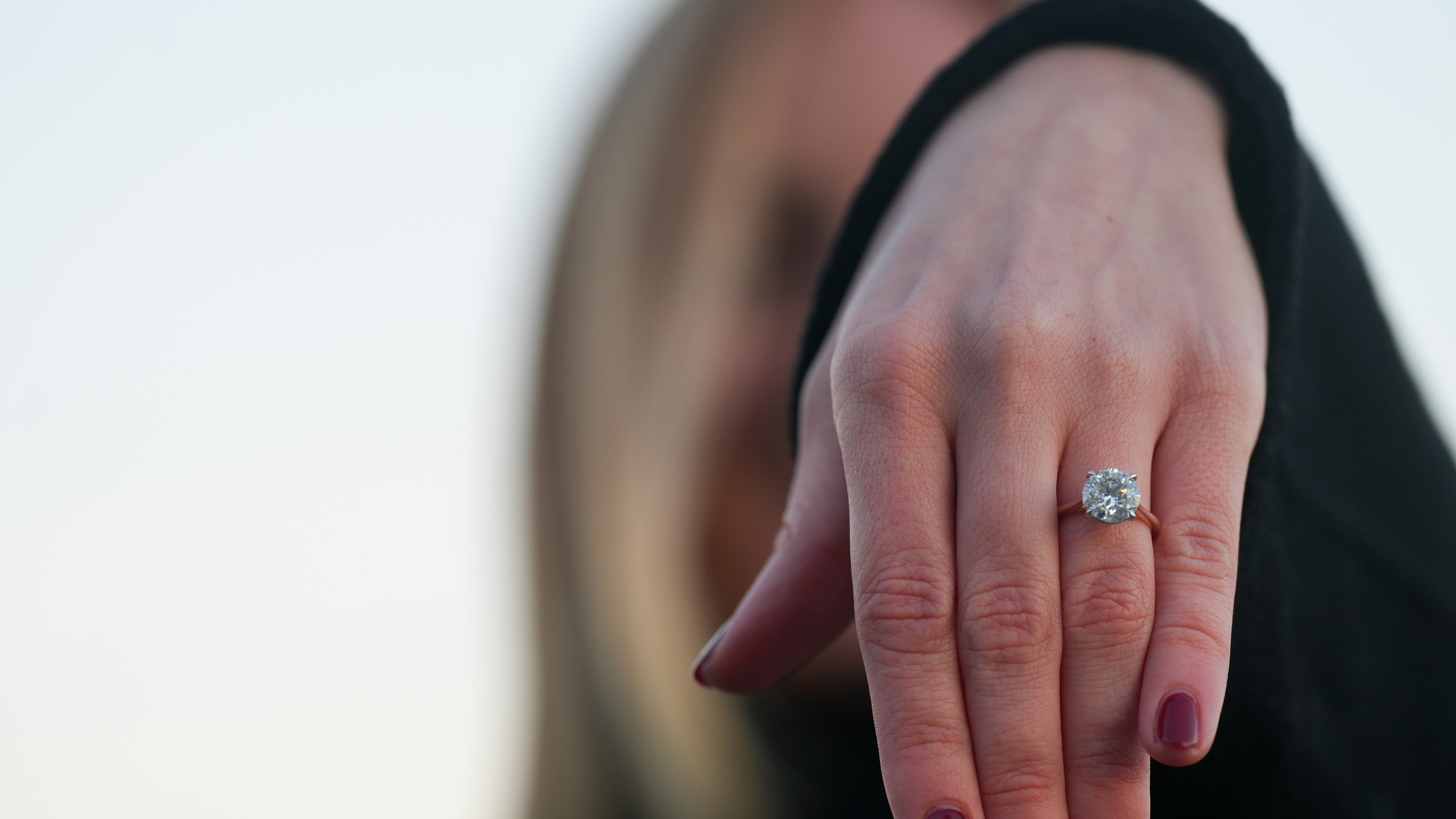 A sleek bezel-set diamond ring showing modern protection and clean lines - engagement ring trends 2024